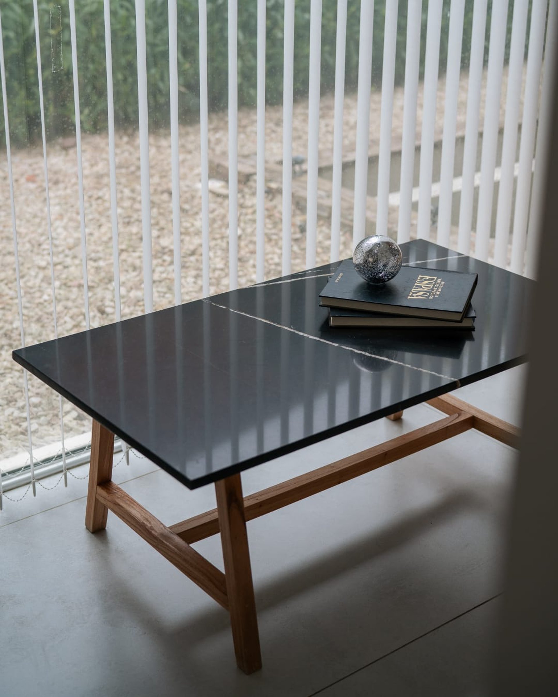 an abstract photo of a curved building with a blue sky in the background