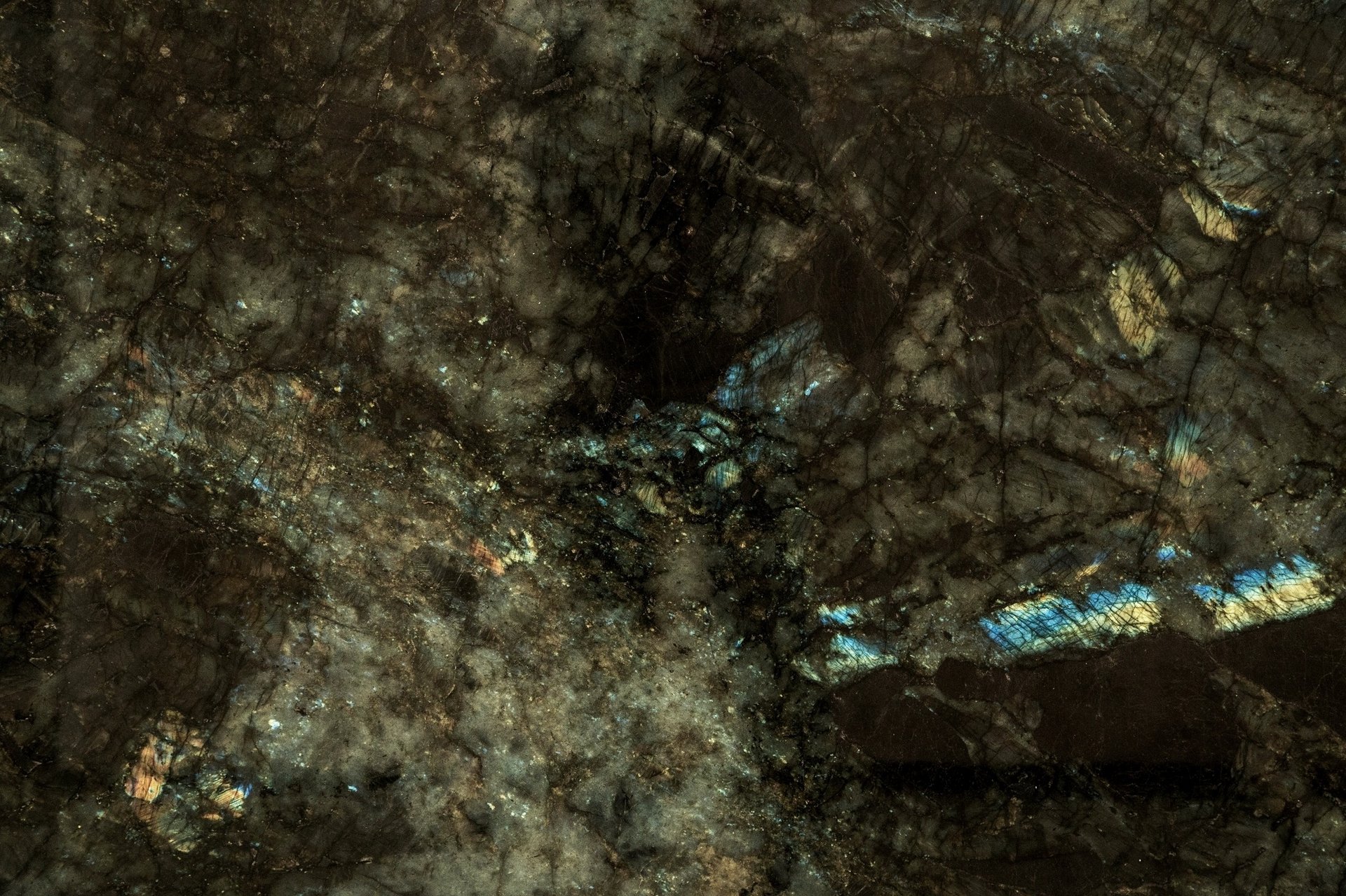 an abstract photo of a curved building with a blue sky in the background