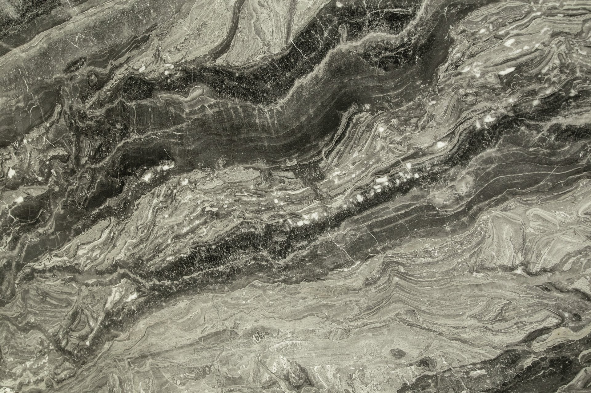 an abstract photo of a curved building with a blue sky in the background