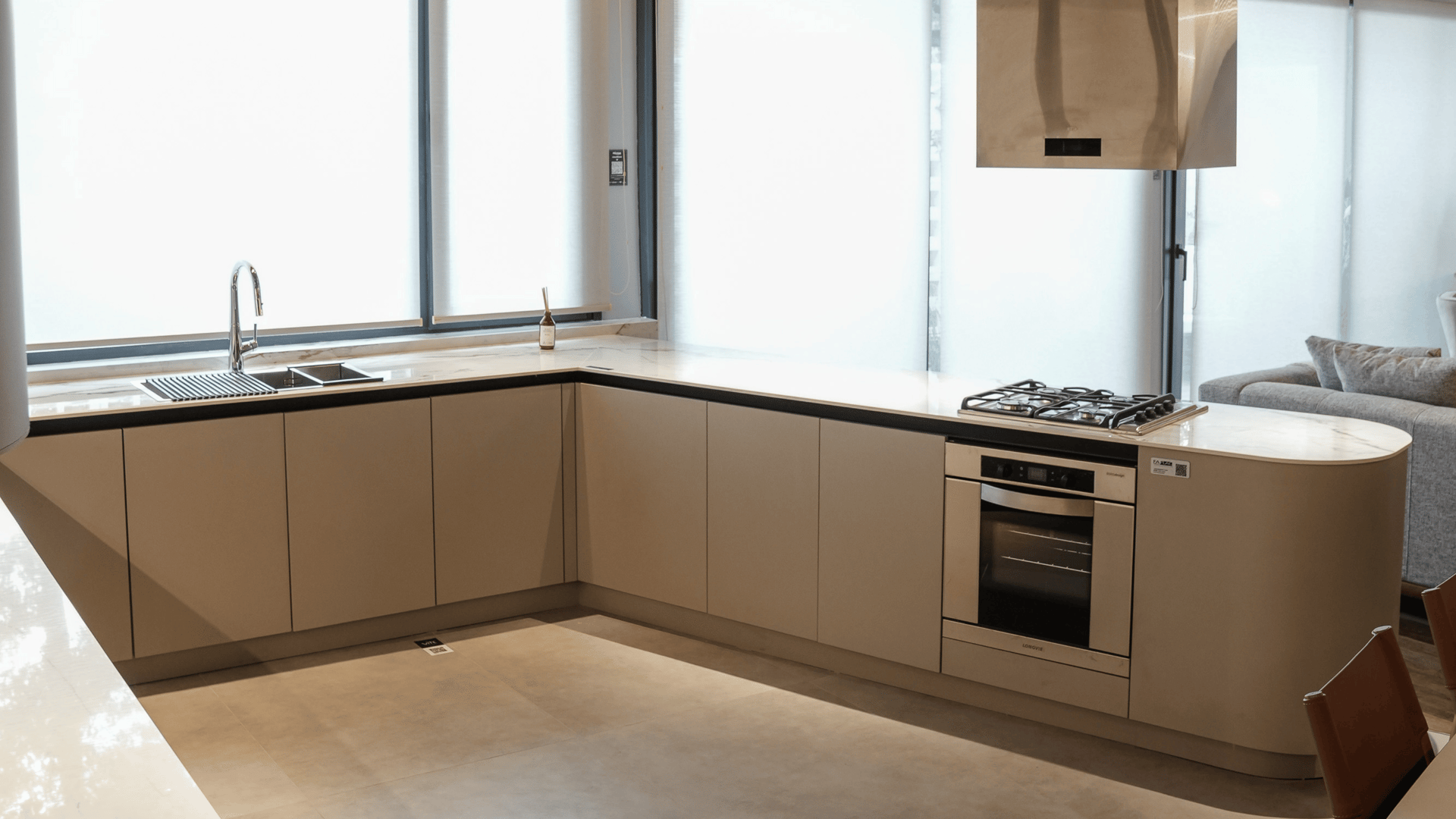 an abstract photo of a curved building with a blue sky in the background