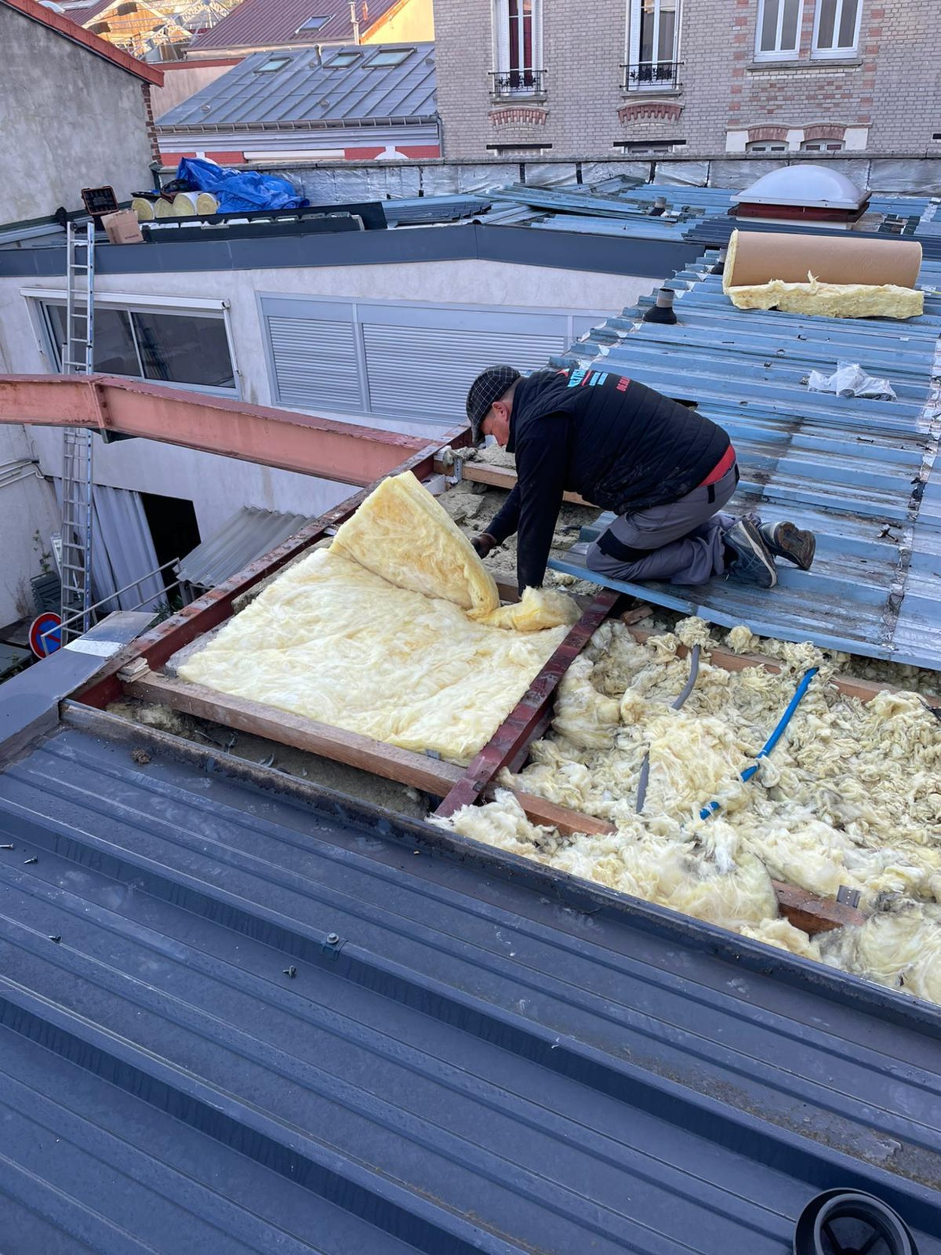 person in blue pants sitting on brown wooden floor