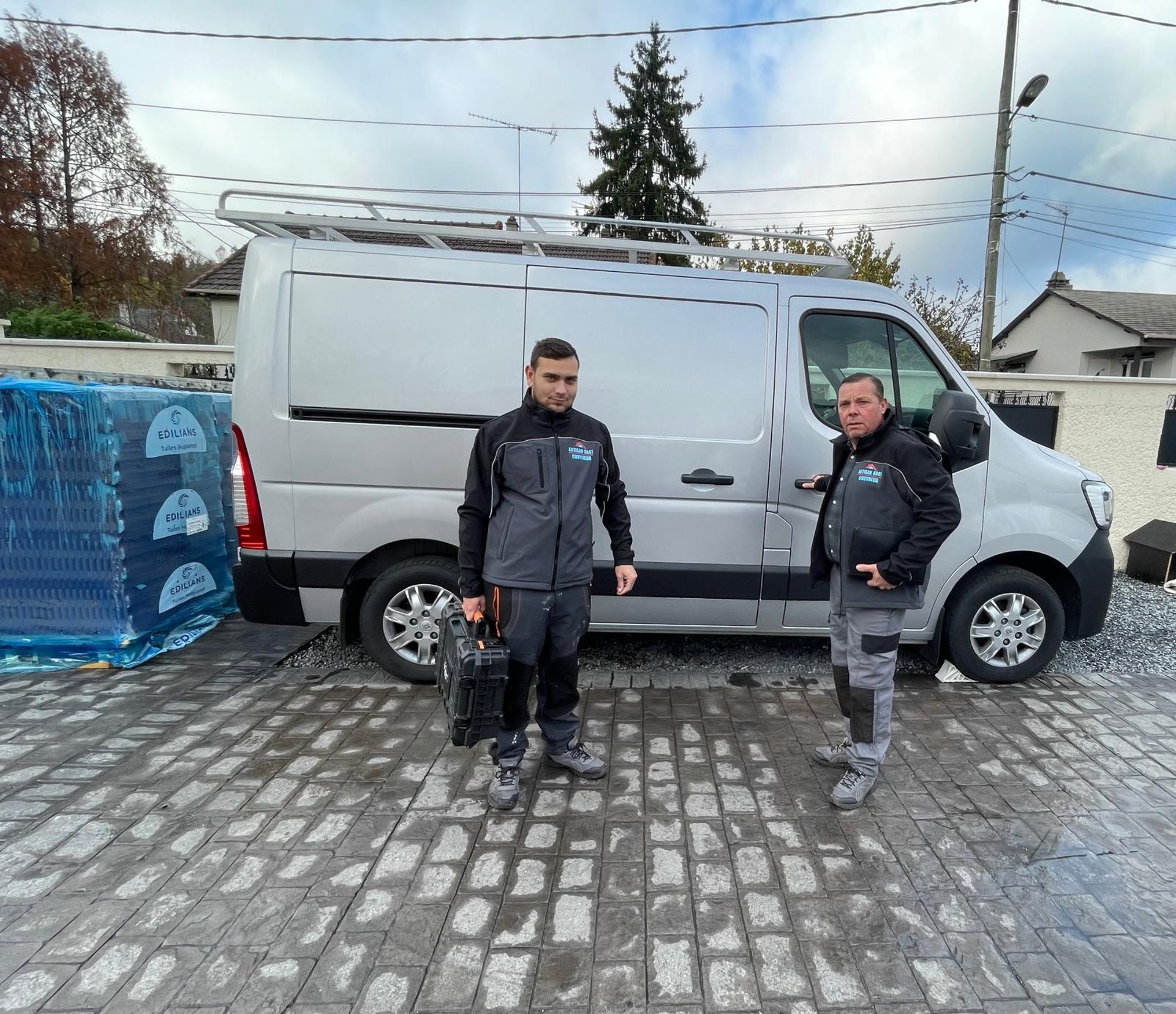 a person wearing blue gloves and holding a hammer