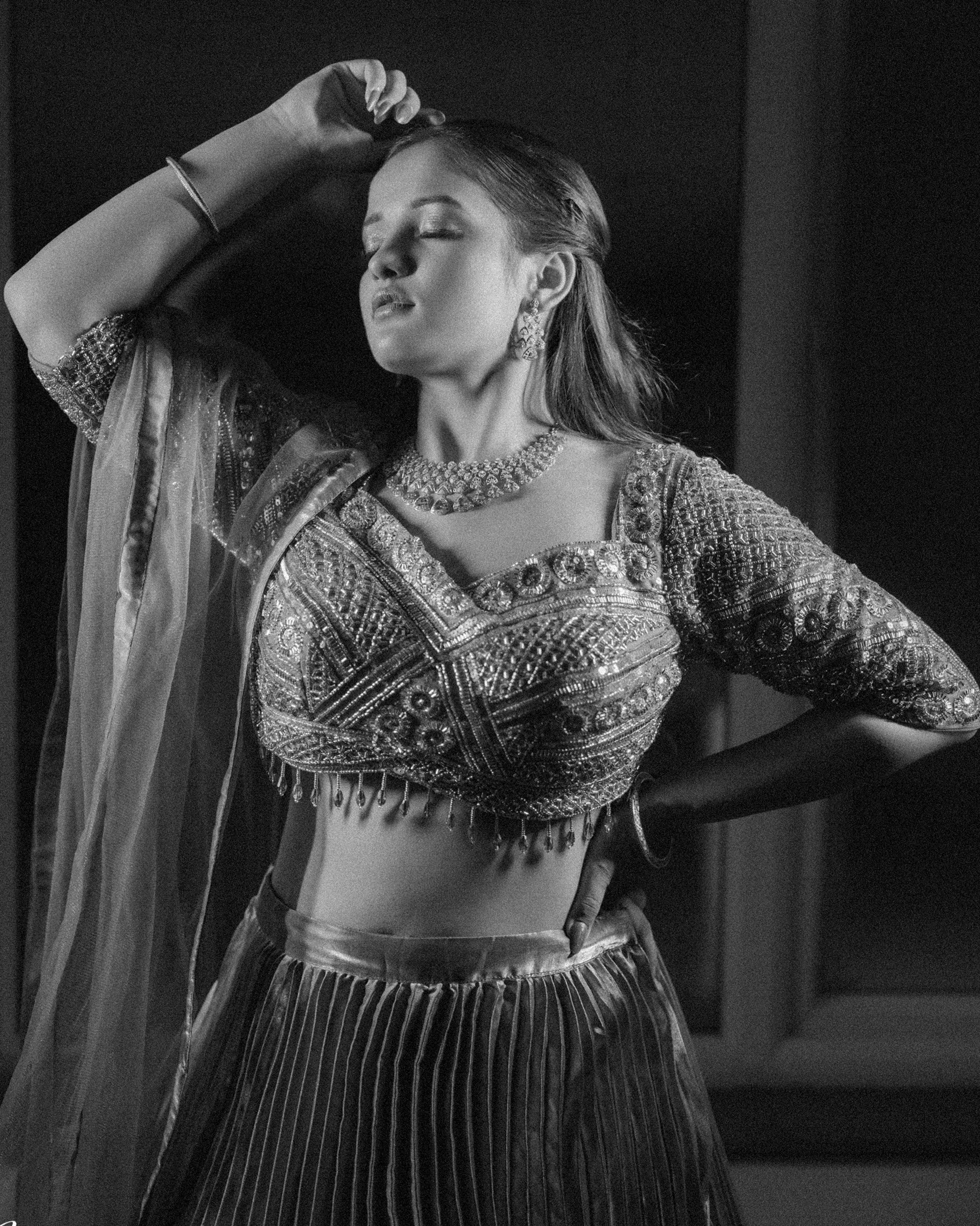 woman wearing yellow long-sleeved dress under white clouds and blue sky during daytime