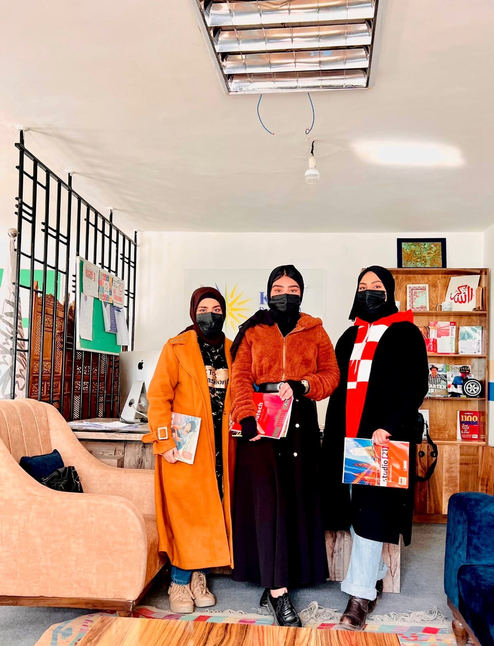 woman wearing yellow long-sleeved dress under white clouds and blue sky during daytime