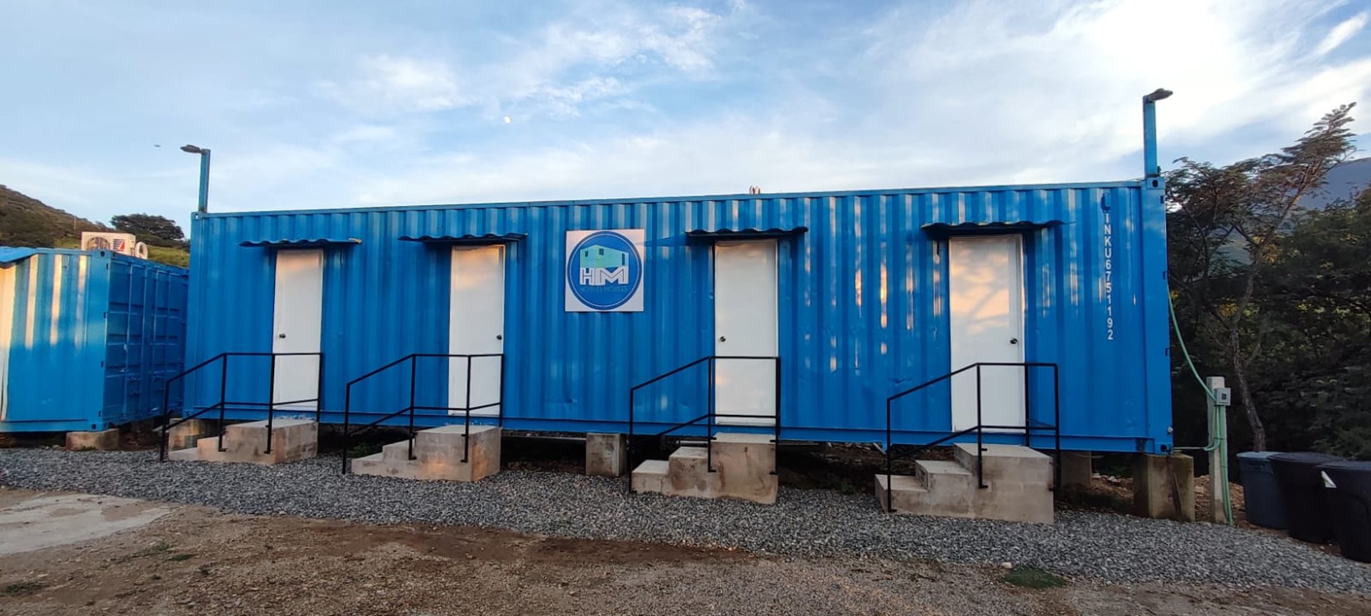 an abstract photo of a curved building with a blue sky in the background