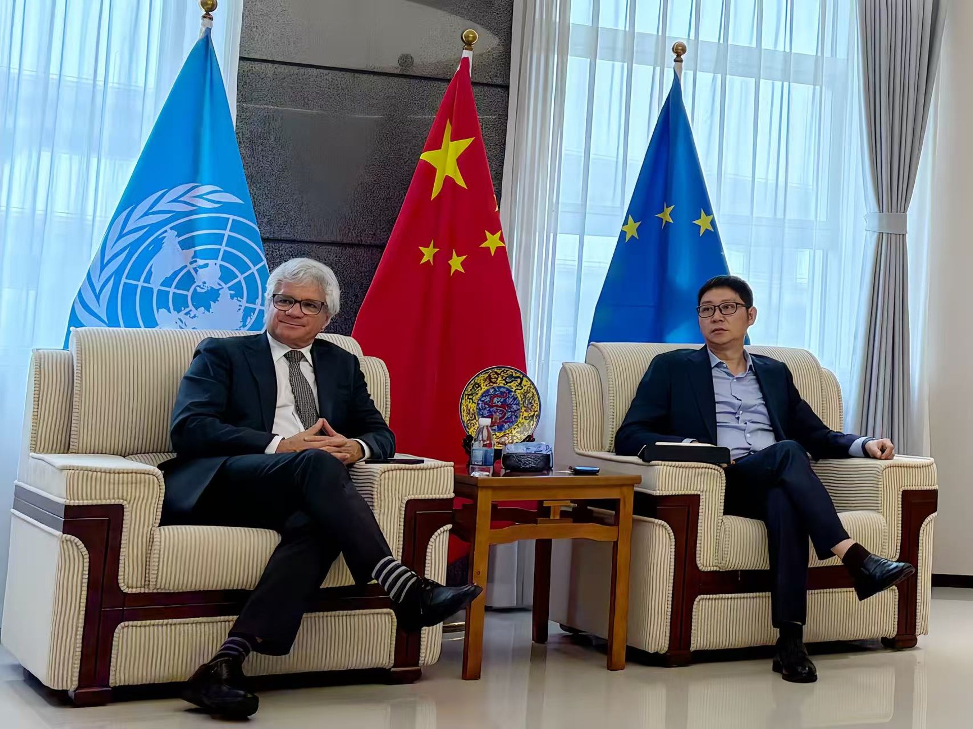 man wearing black jacket holding rod