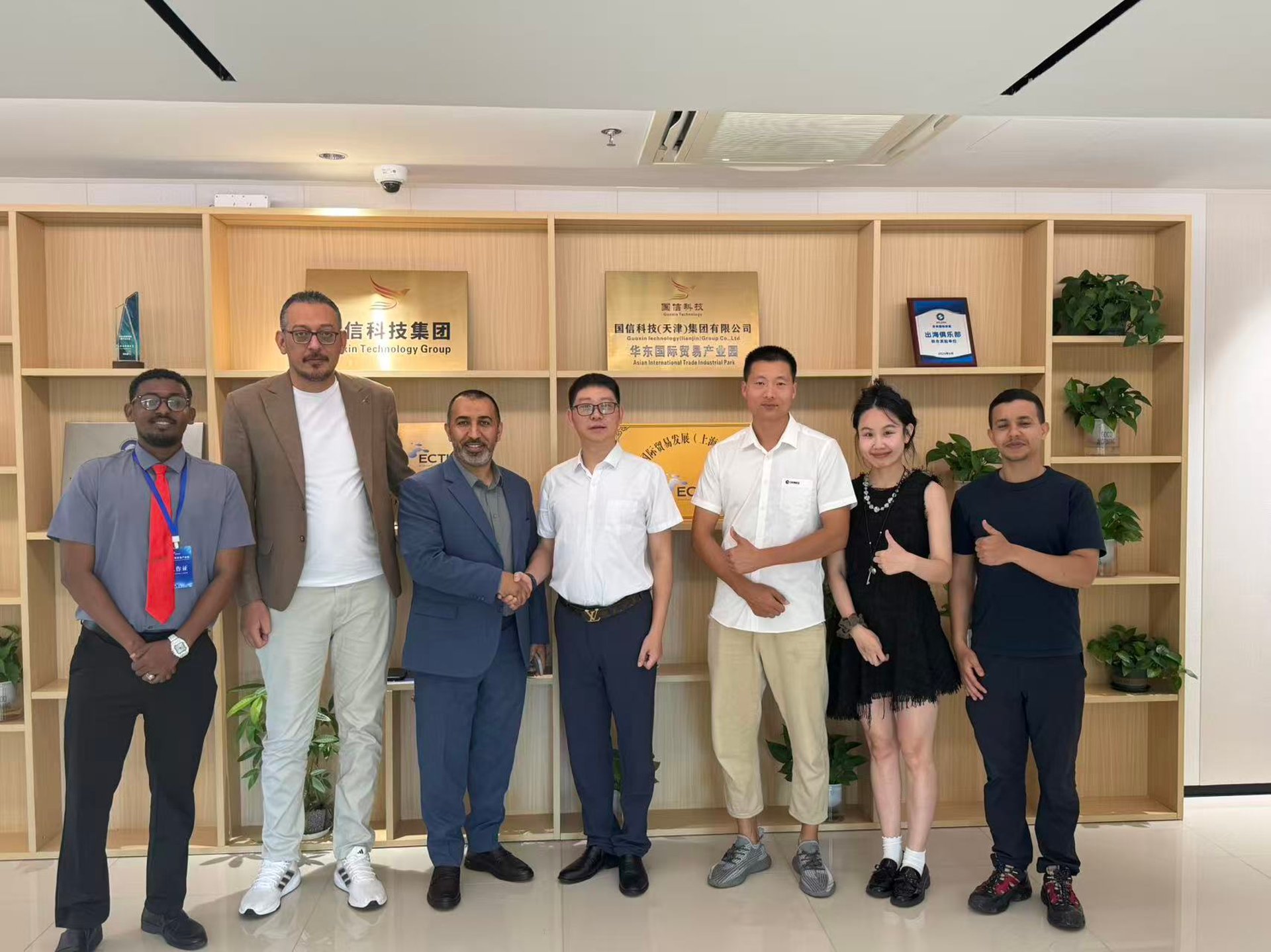 A man sanding a wooden table with a sander