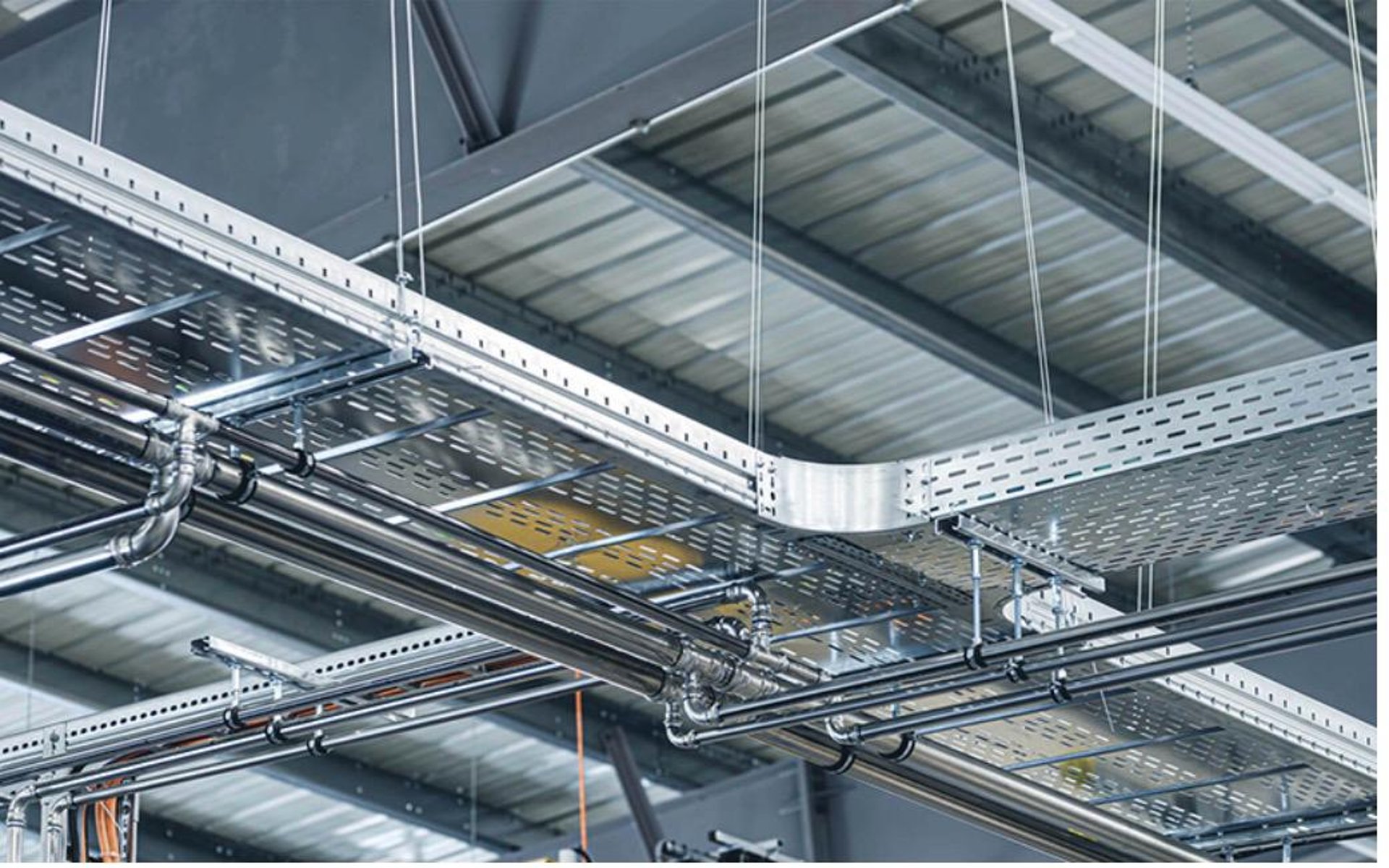 an abstract photo of a curved building with a blue sky in the background