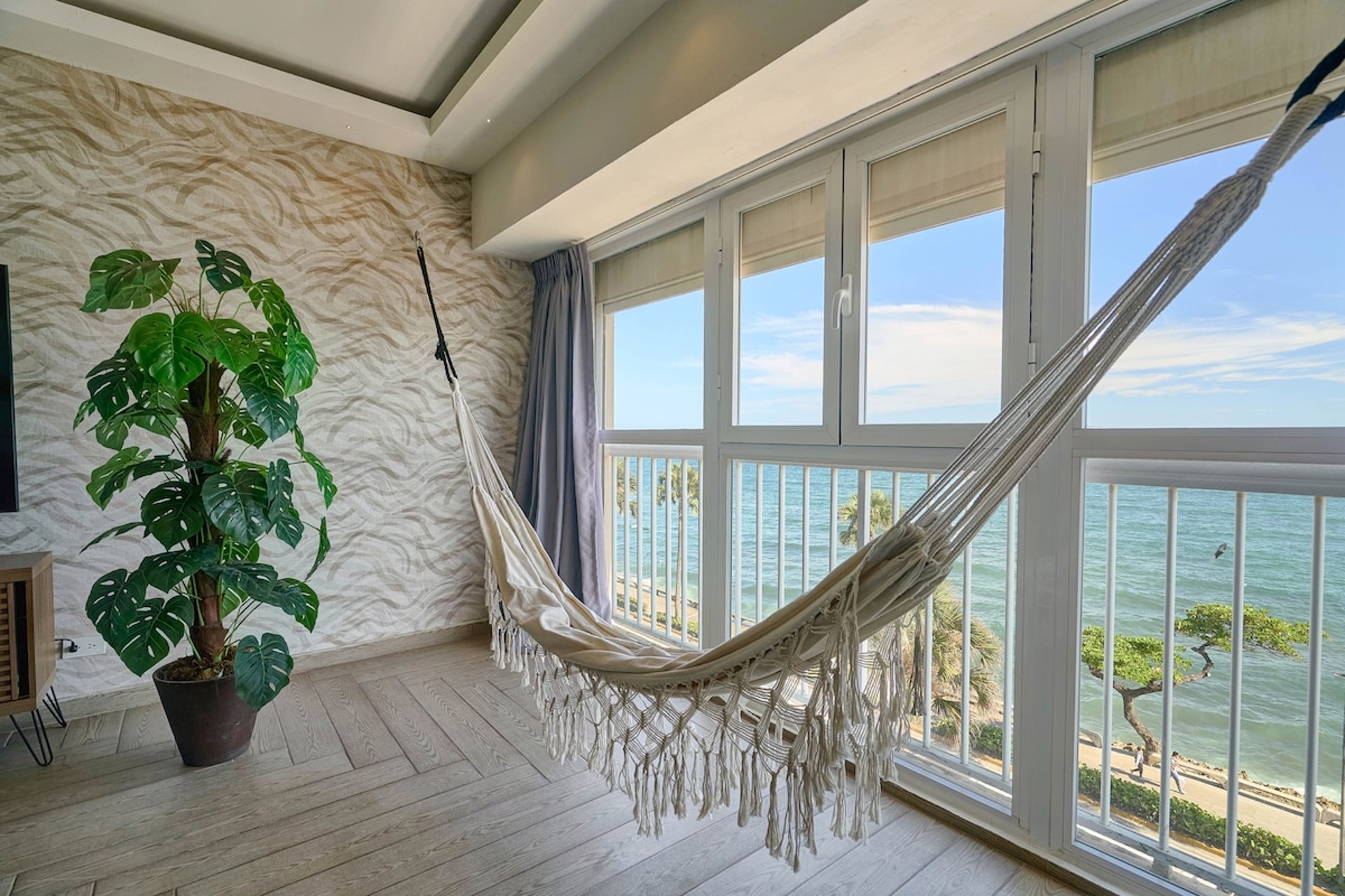 an abstract photo of a curved building with a blue sky in the background