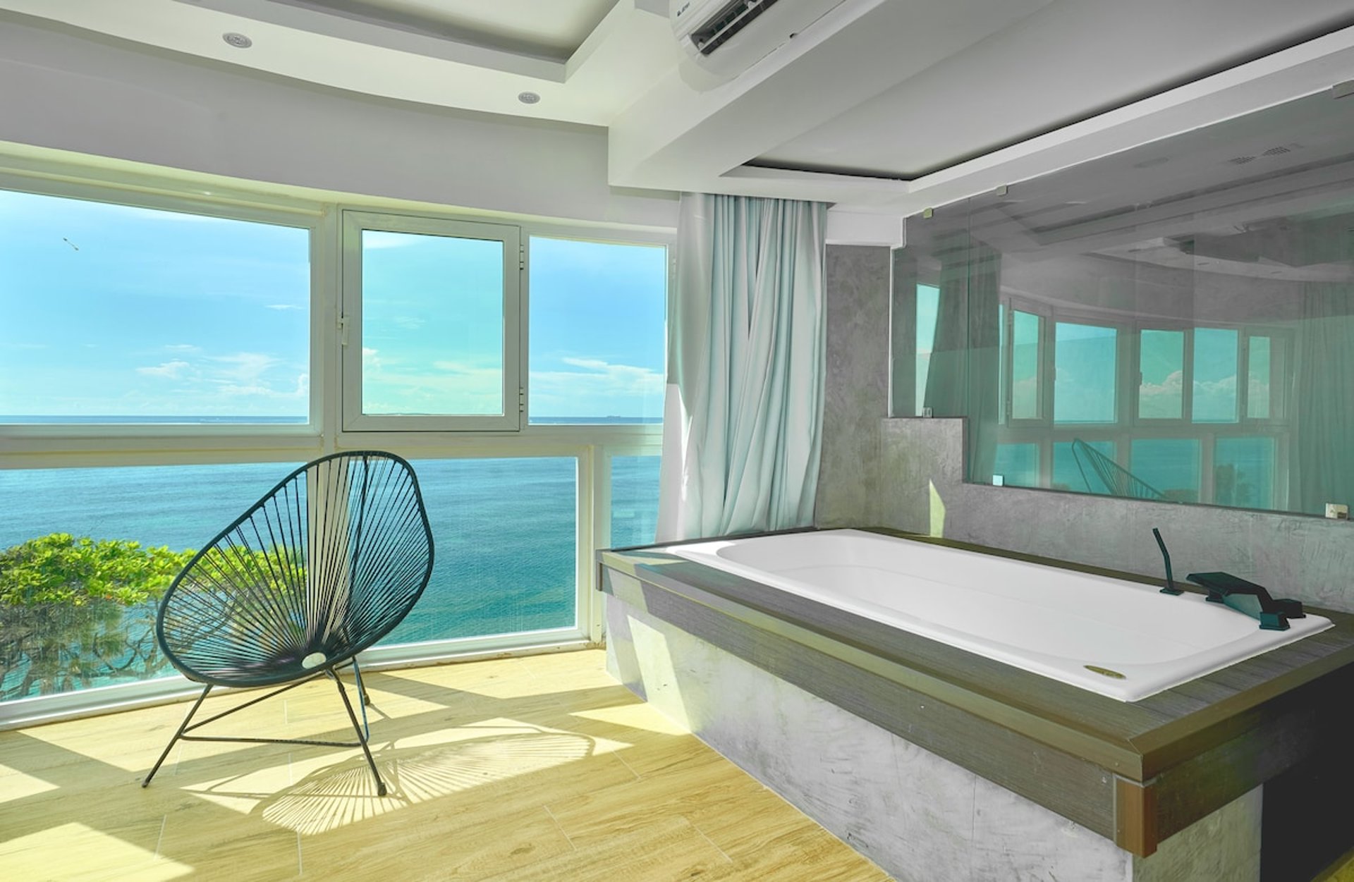 an abstract photo of a curved building with a blue sky in the background