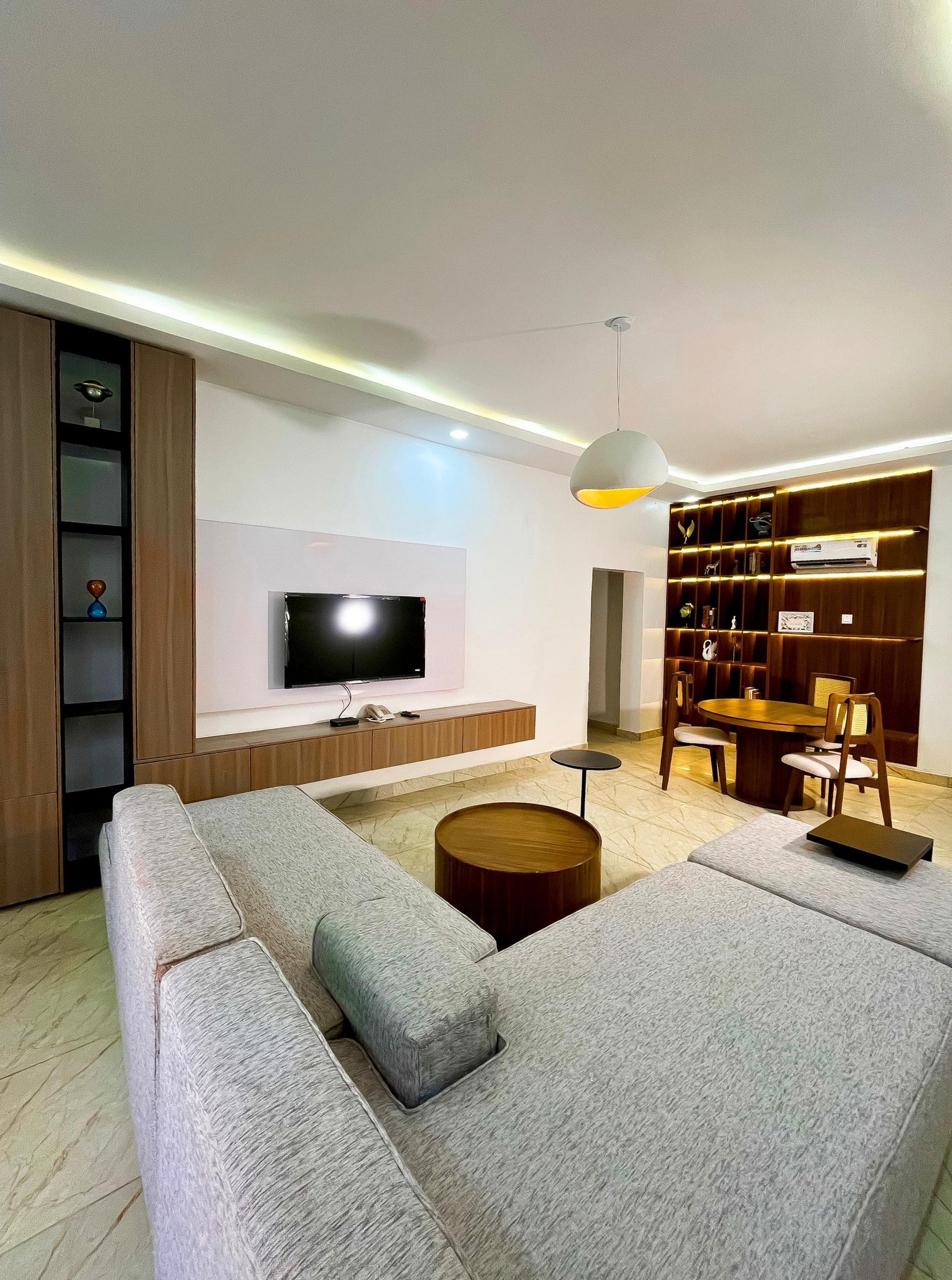 an abstract photo of a curved building with a blue sky in the background