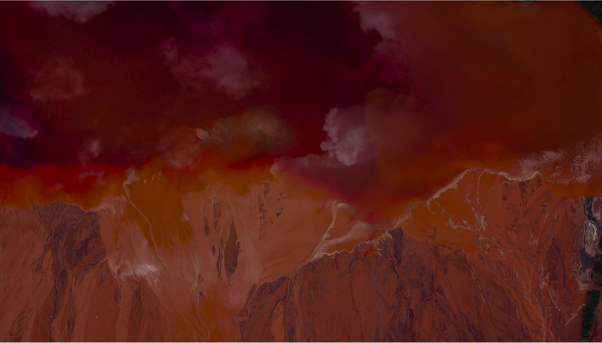 an abstract photo of a curved building with a blue sky in the background