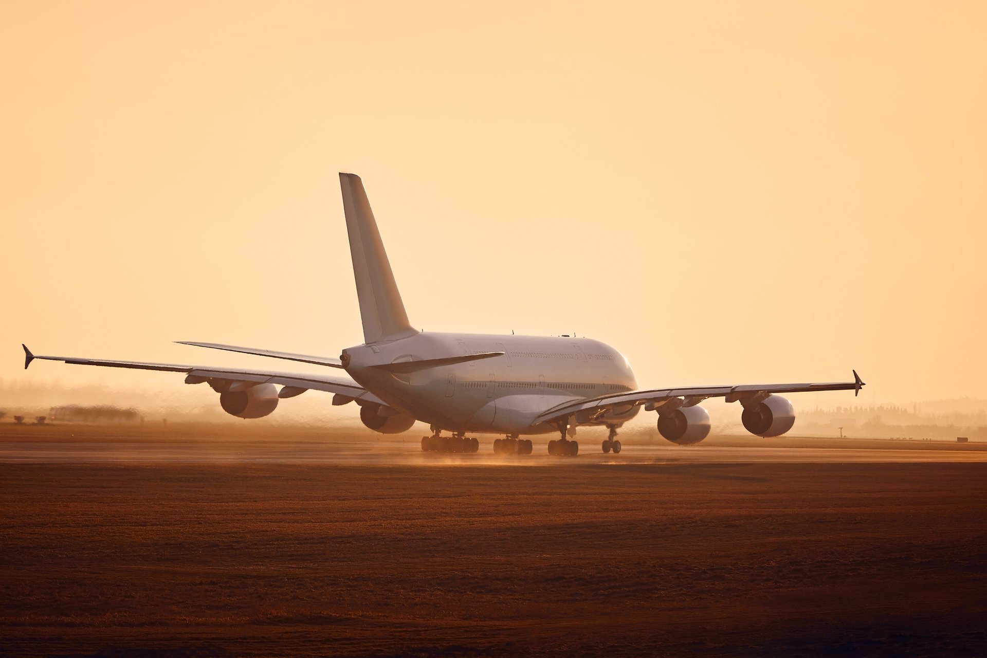 white airplane on airport during daytime