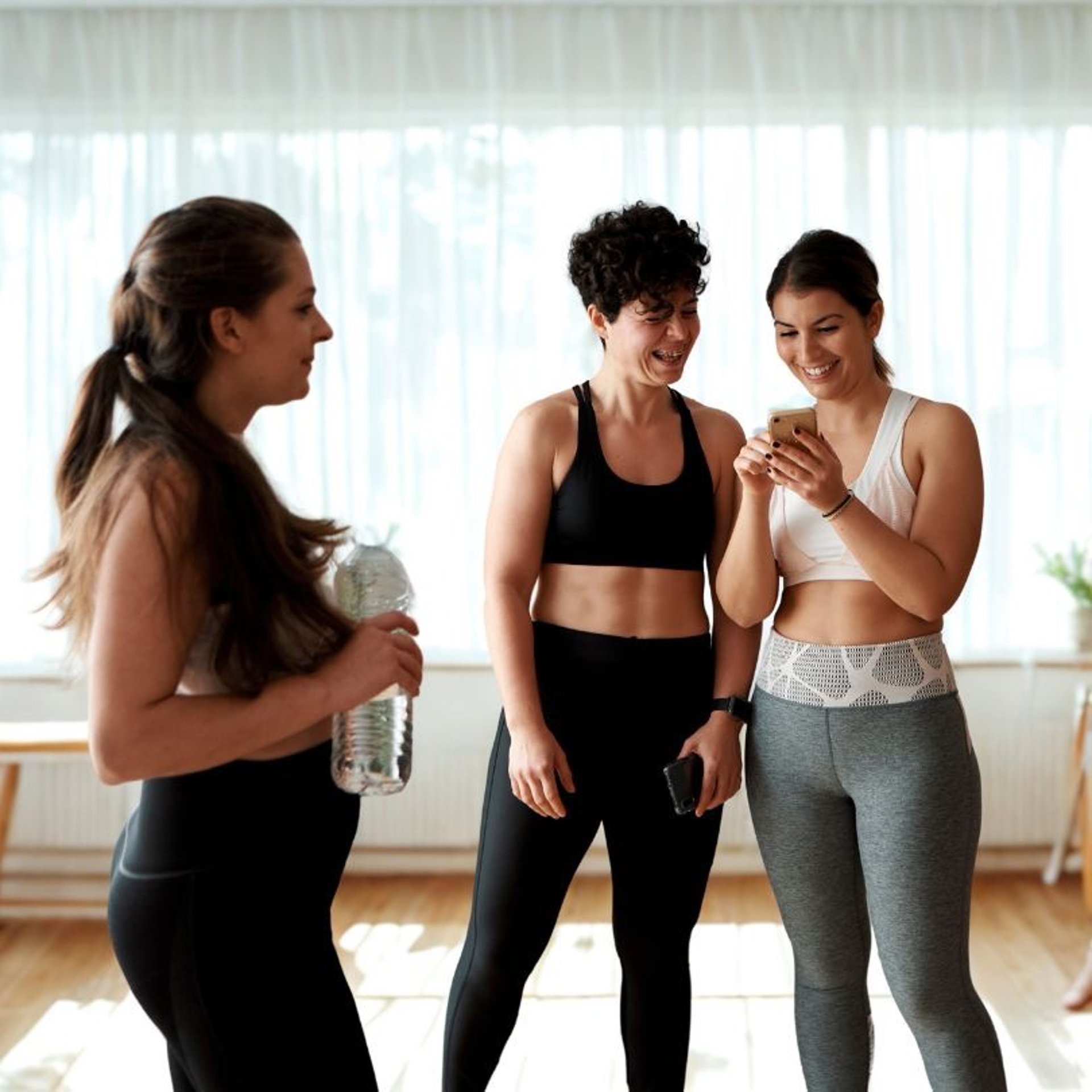 an abstract photo of a curved building with a blue sky in the background