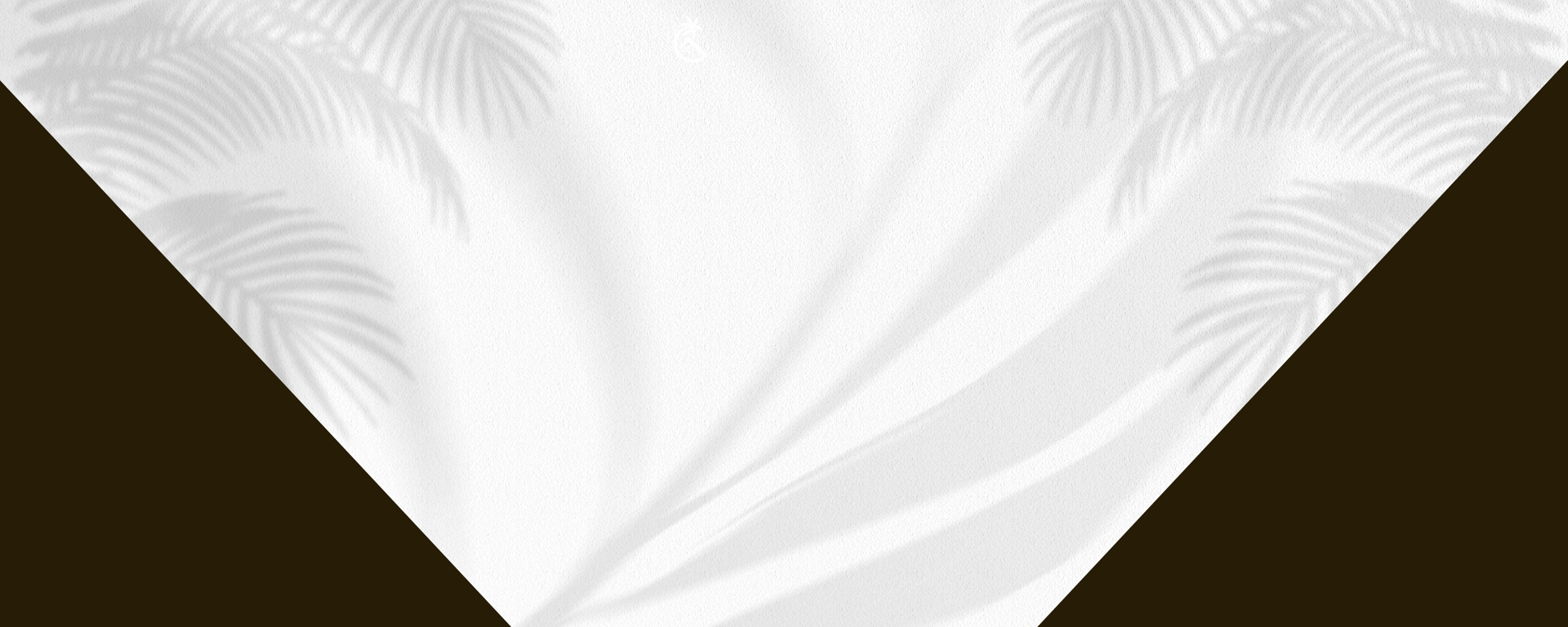 low-angle photo of Hotel lighted signage on top of brown building during nighttime