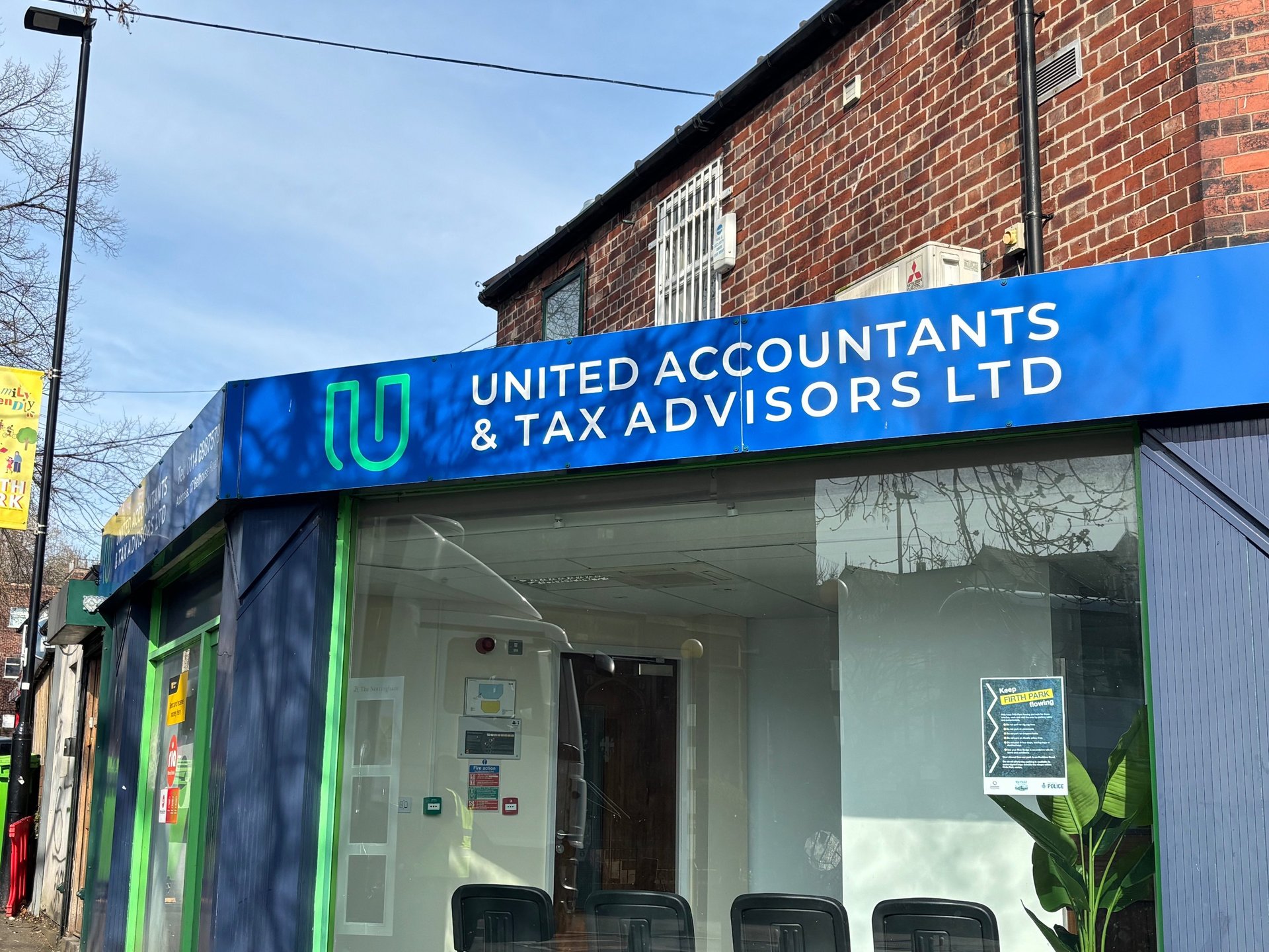 an abstract photo of a curved building with a blue sky in the background