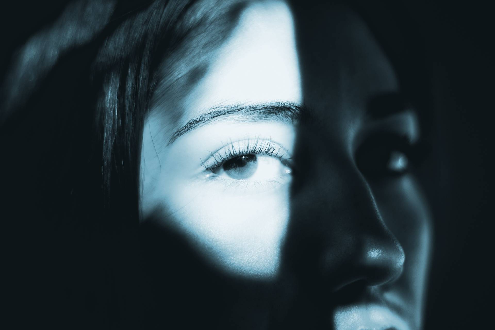 an abstract photo of a curved building with a blue sky in the background