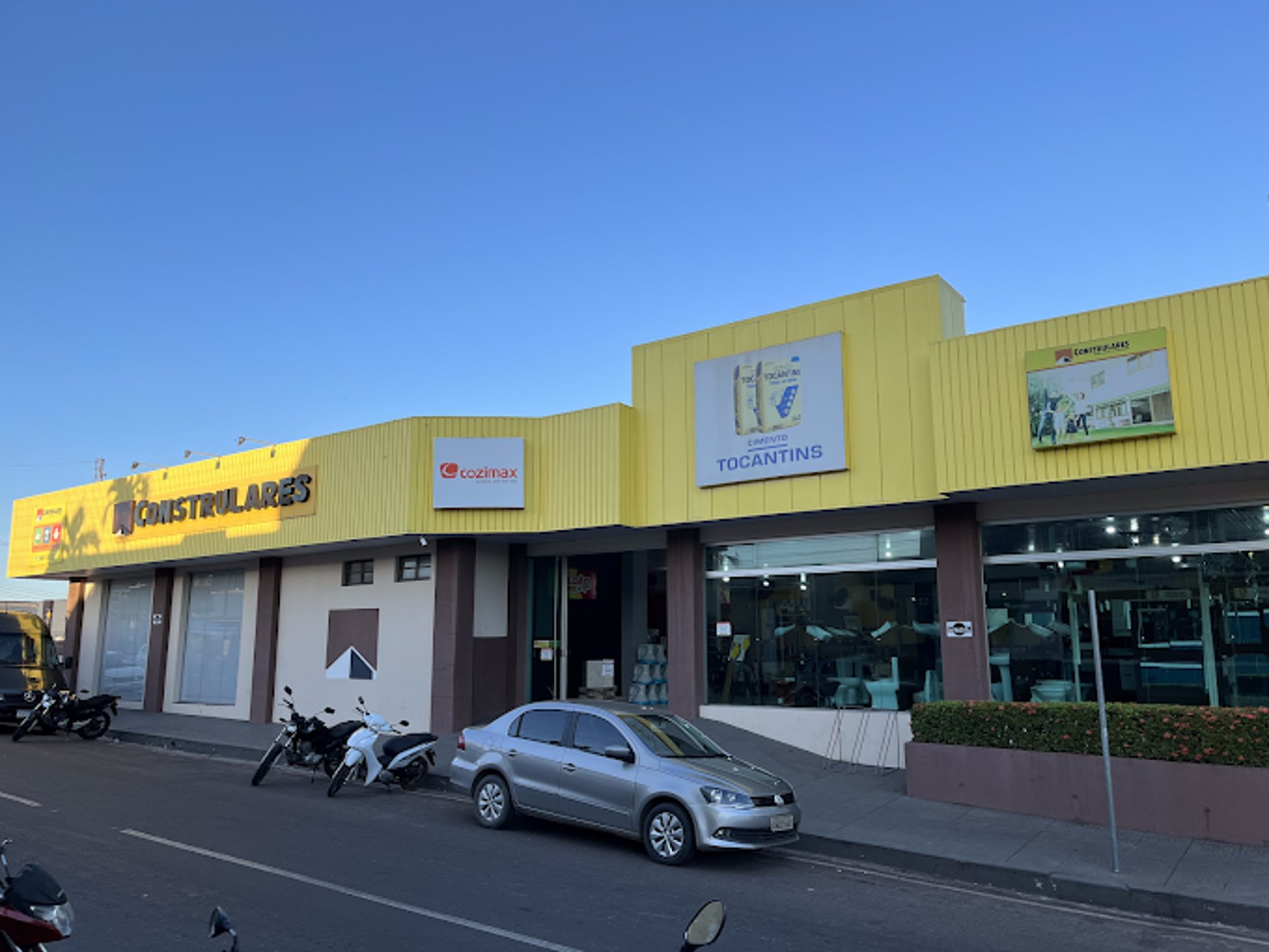an abstract photo of a curved building with a blue sky in the background