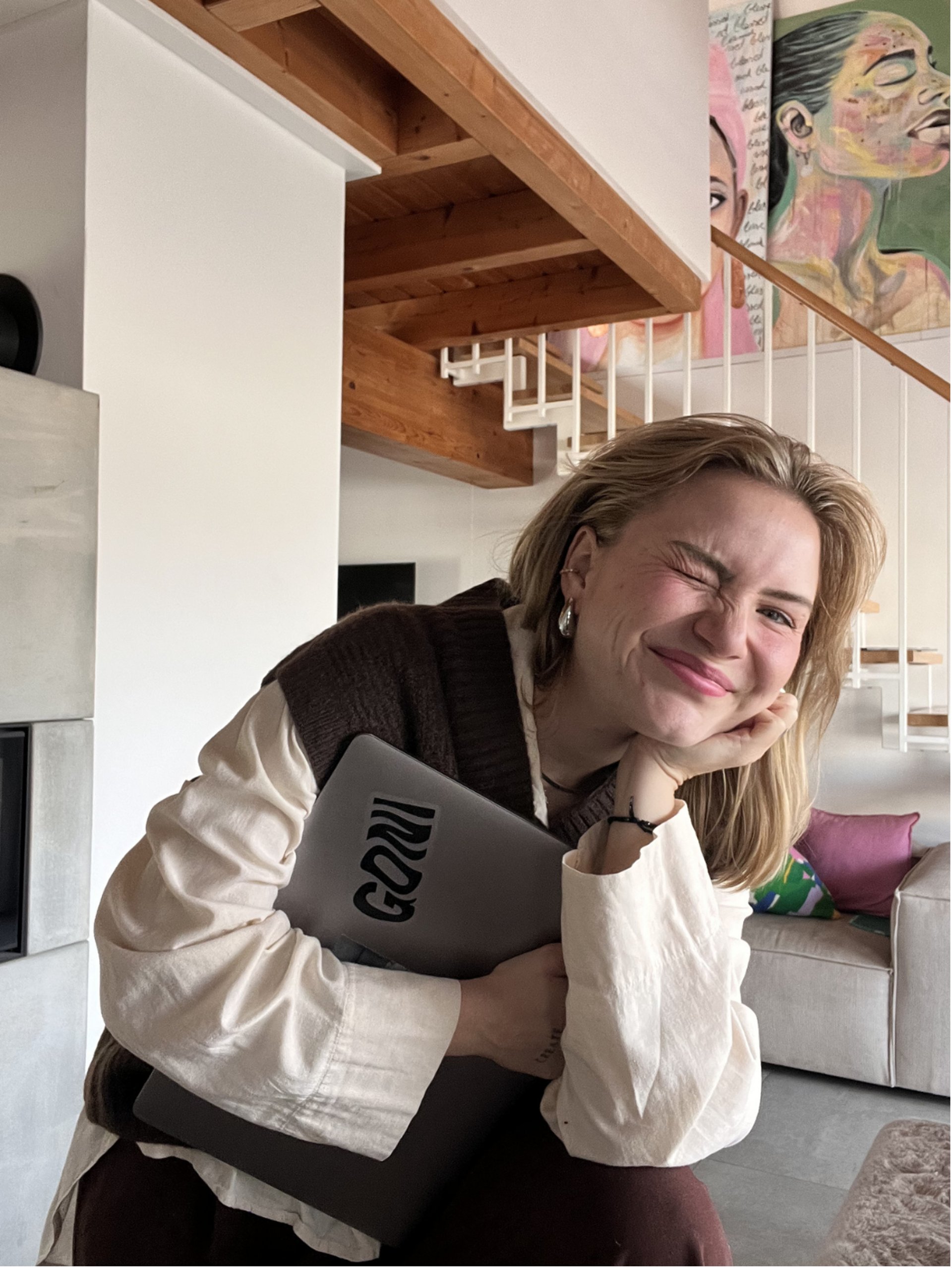 an abstract photo of a curved building with a blue sky in the background
