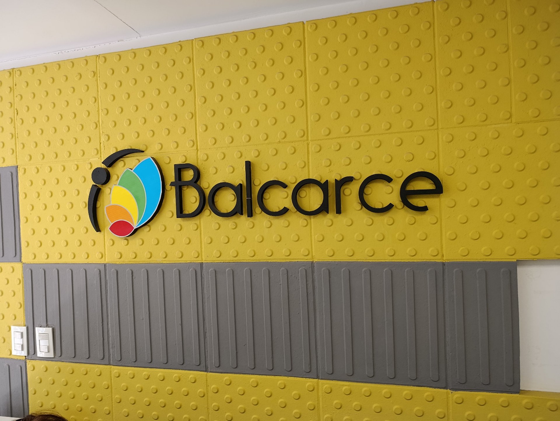 an abstract photo of a curved building with a blue sky in the background