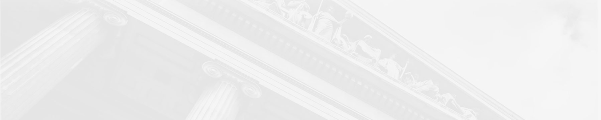 Classical building facade with clock and columns