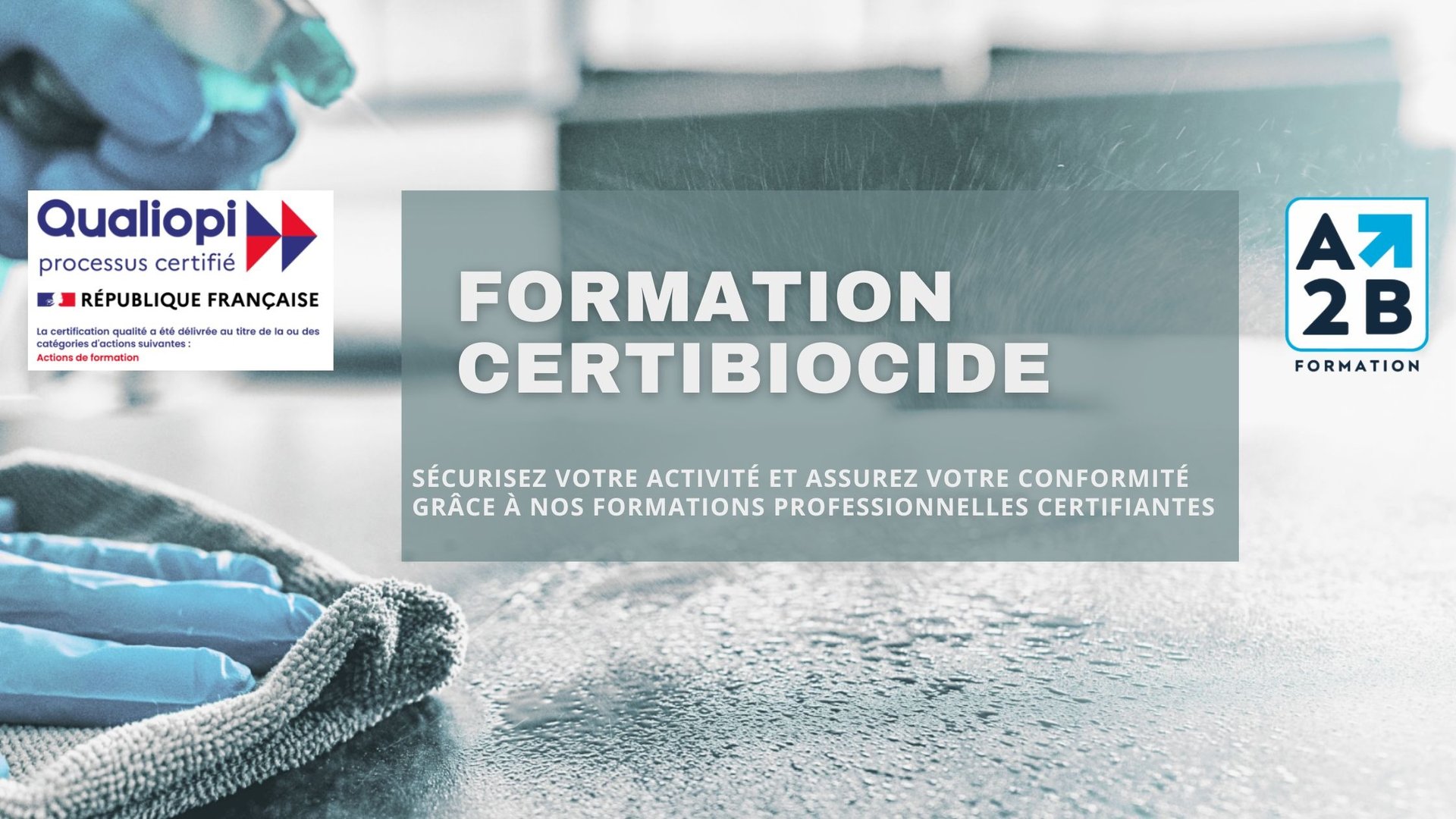 A person in yellow gloves and blue gloves cleaning a floor