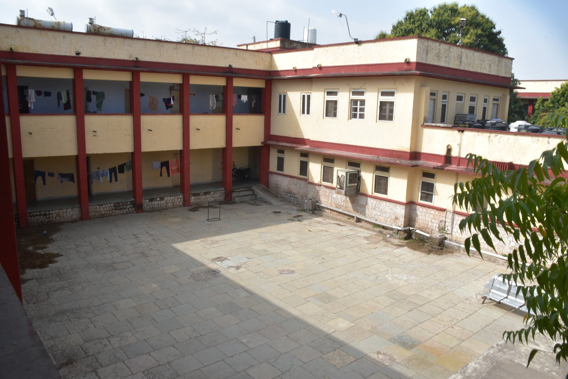 woman wearing yellow long-sleeved dress under white clouds and blue sky during daytime