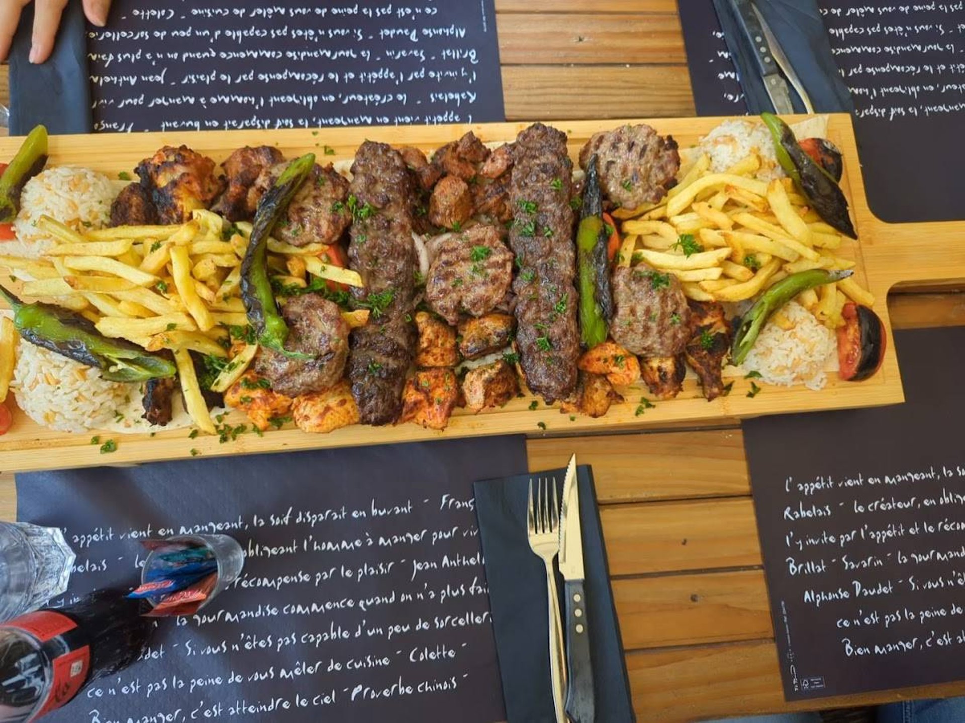an abstract photo of a curved building with a blue sky in the background