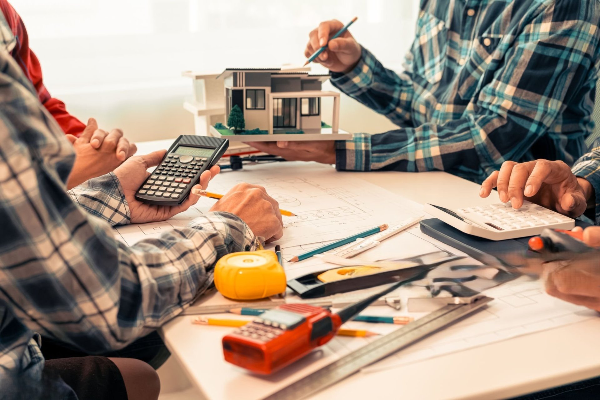 a kitchen with a table and chairs and a skylight