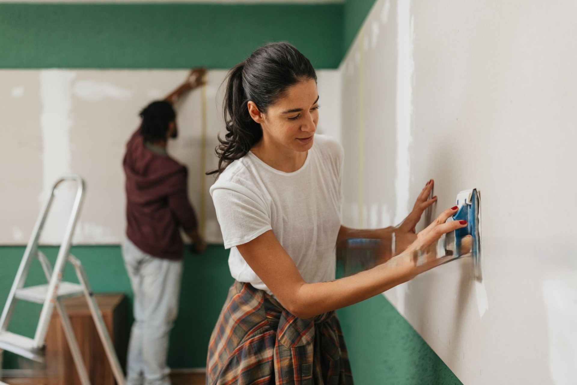 man and woman standing in front of brown concrete building during daytime