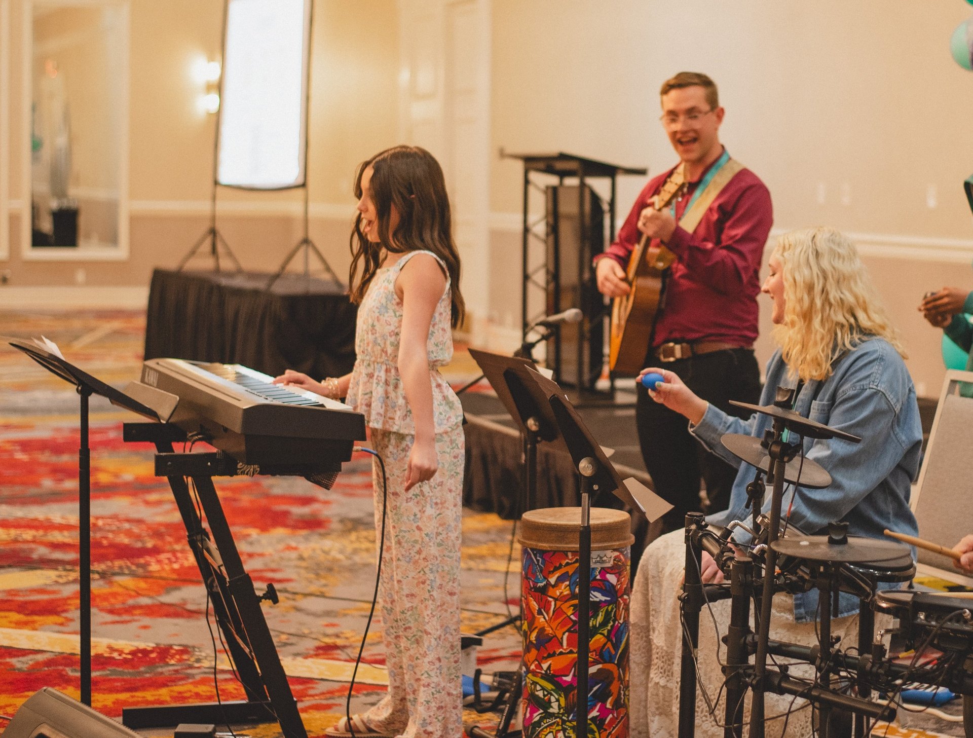 boy near white wooden shelf