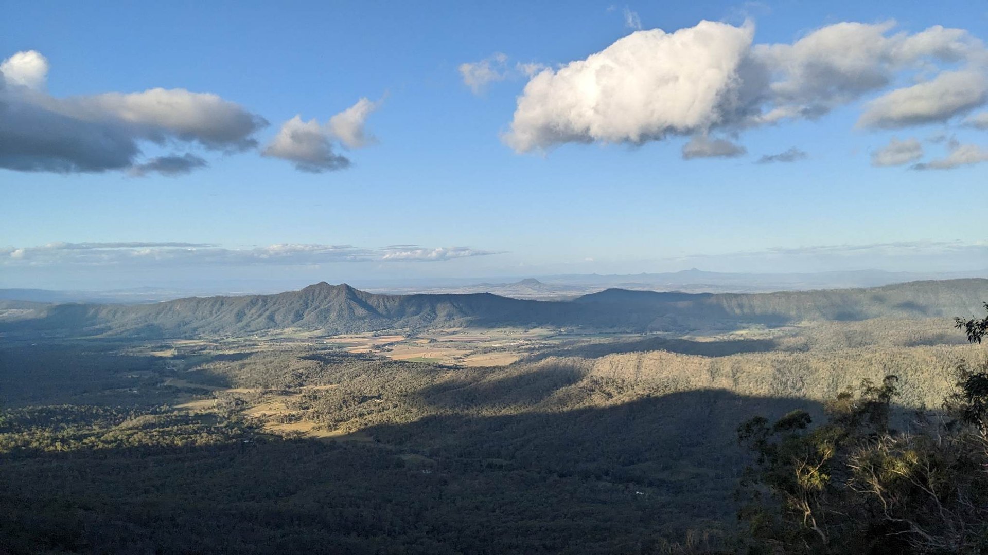 an abstract photo of a curved building with a blue sky in the background