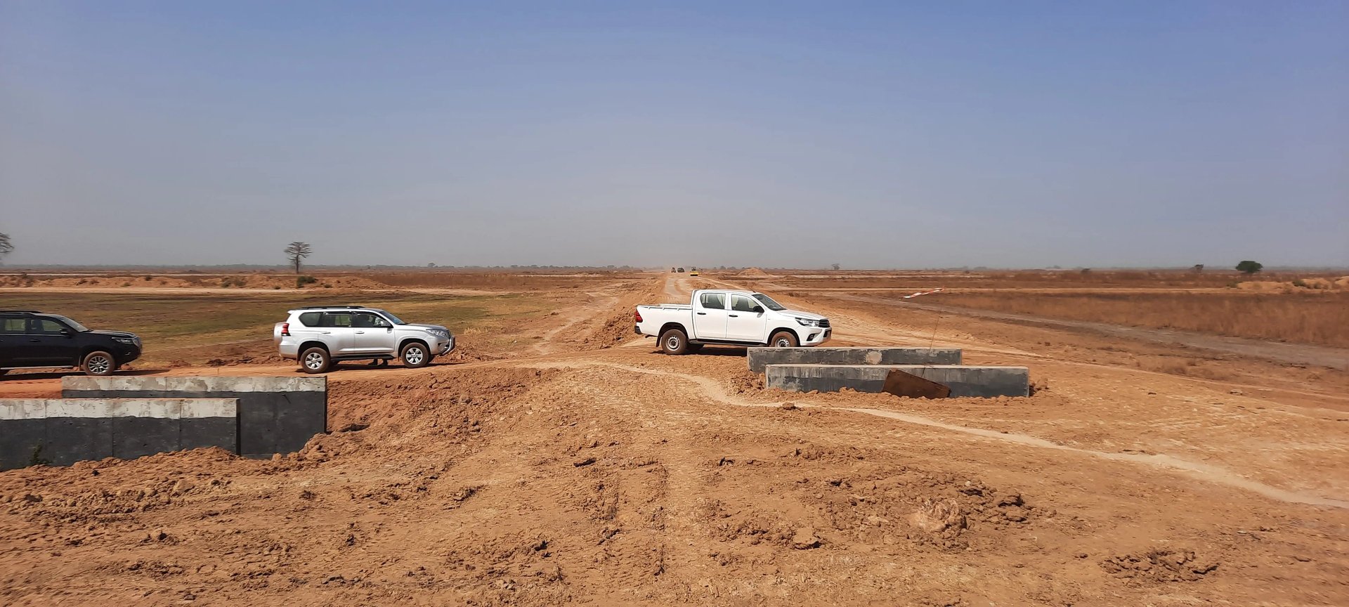 an abstract photo of a curved building with a blue sky in the background