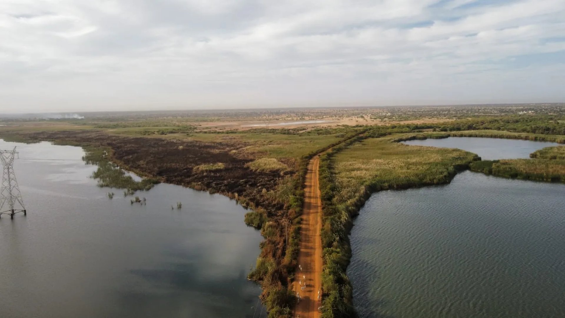 an abstract photo of a curved building with a blue sky in the background
