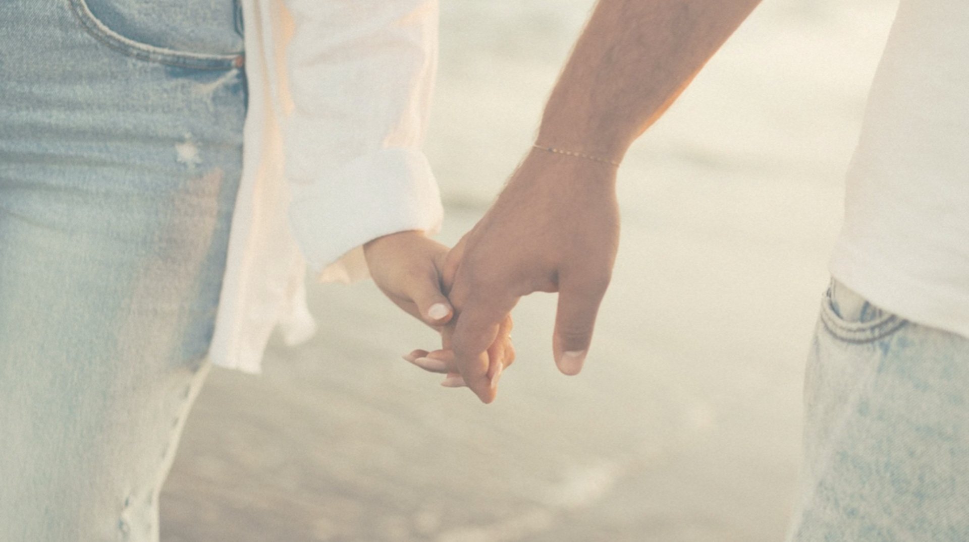 an abstract photo of a curved building with a blue sky in the background