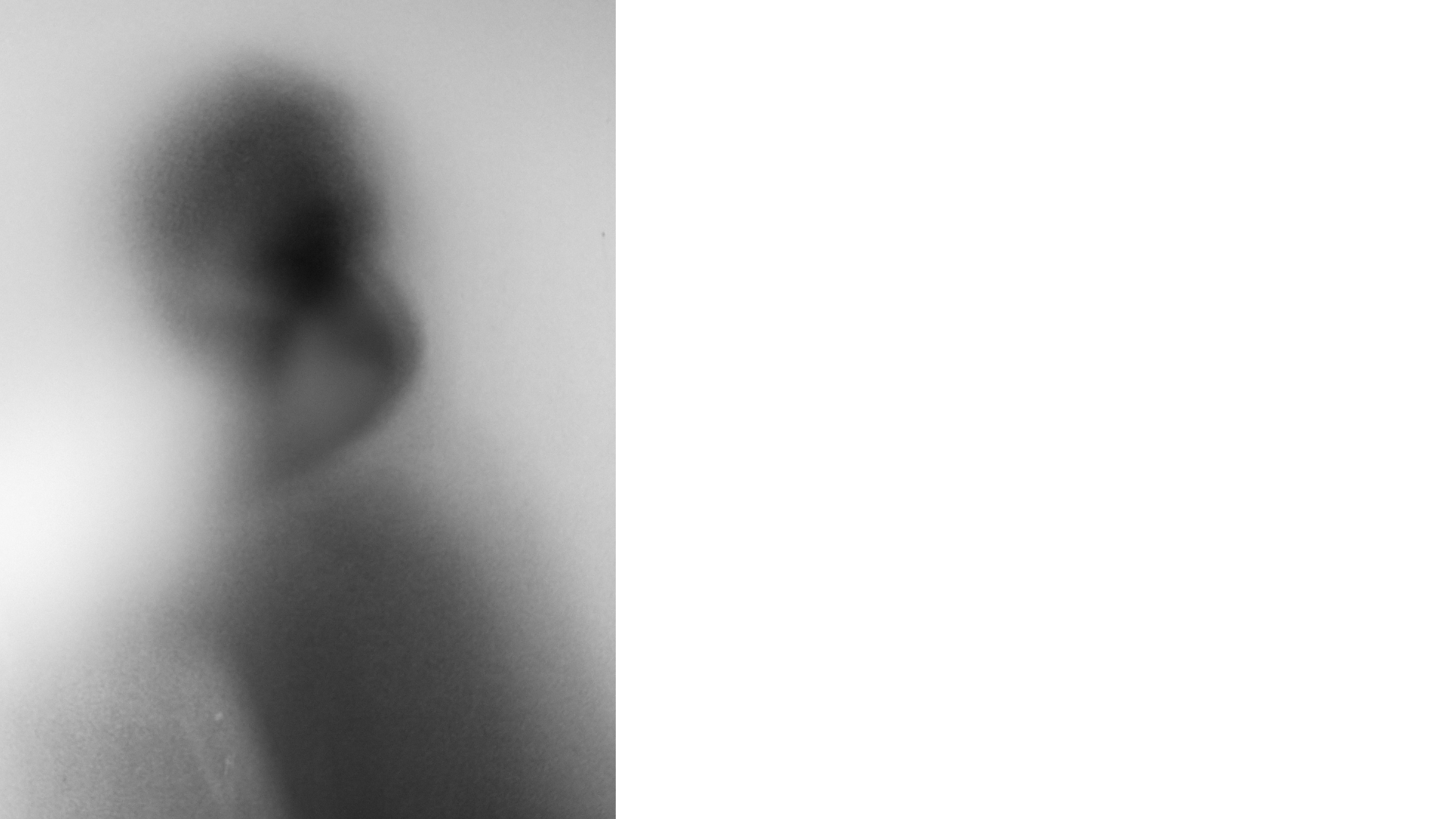 A very diffuse grey image of a woman