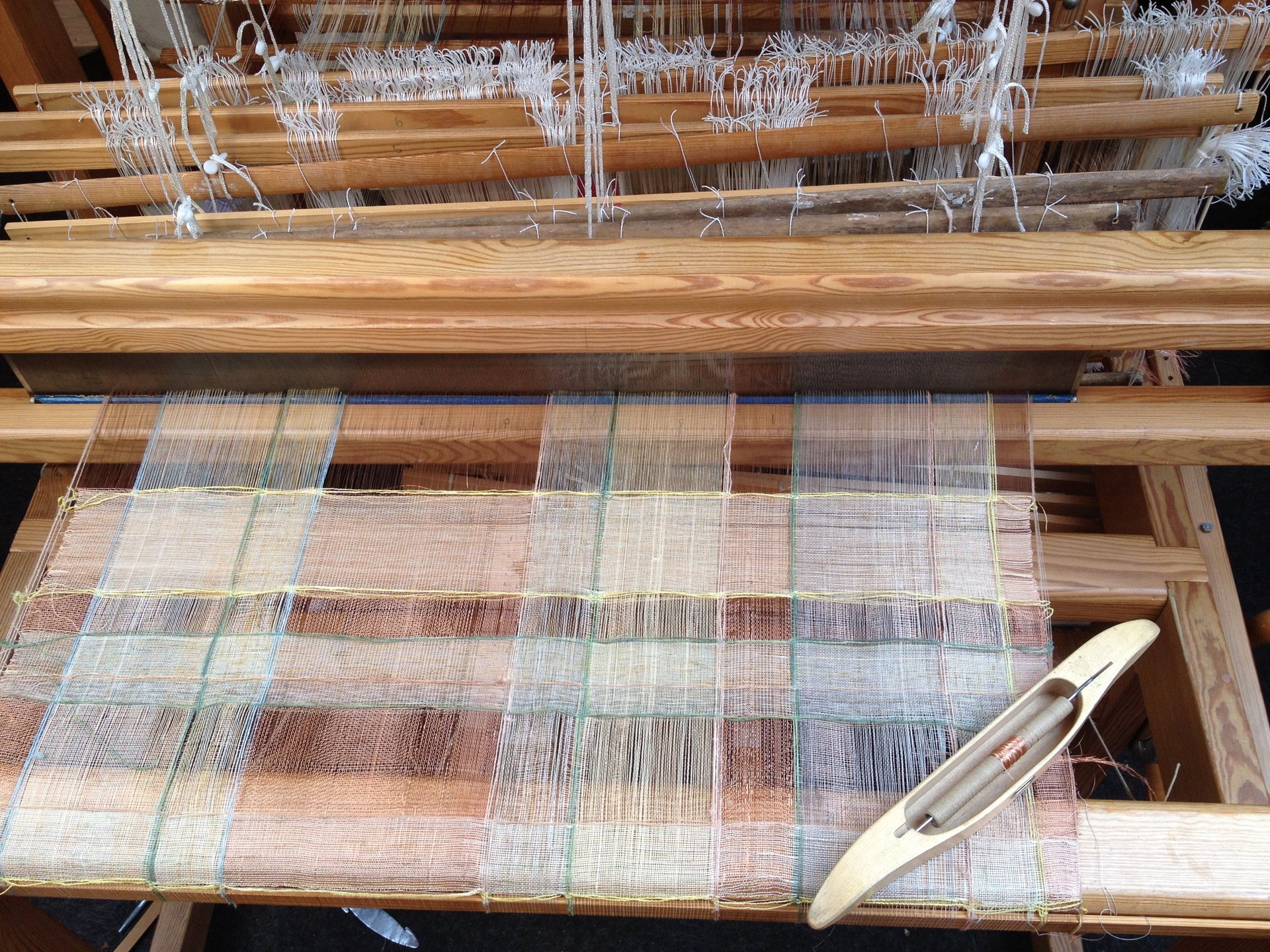 an abstract photo of a curved building with a blue sky in the background
