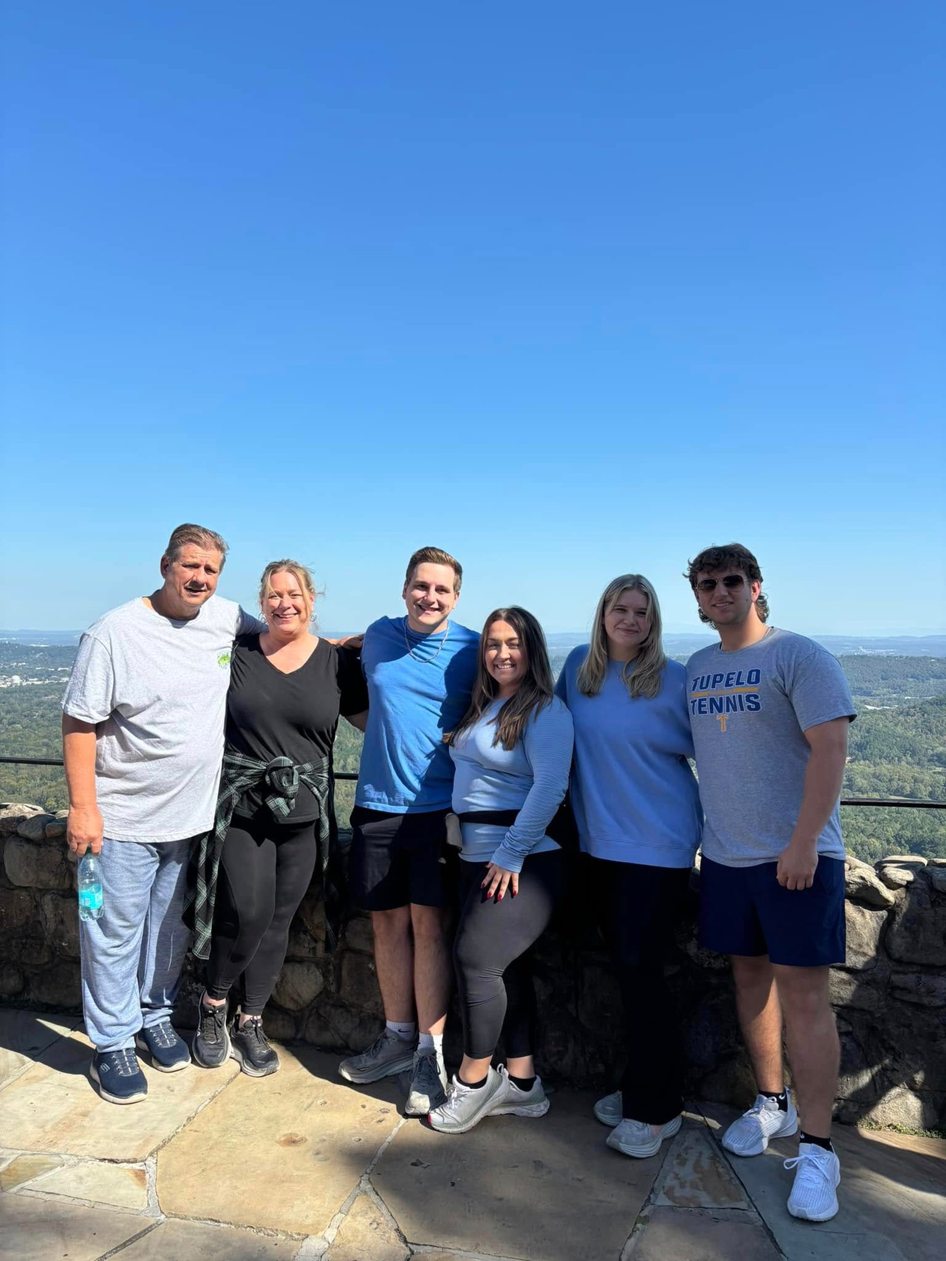 woman wearing yellow long-sleeved dress under white clouds and blue sky during daytime