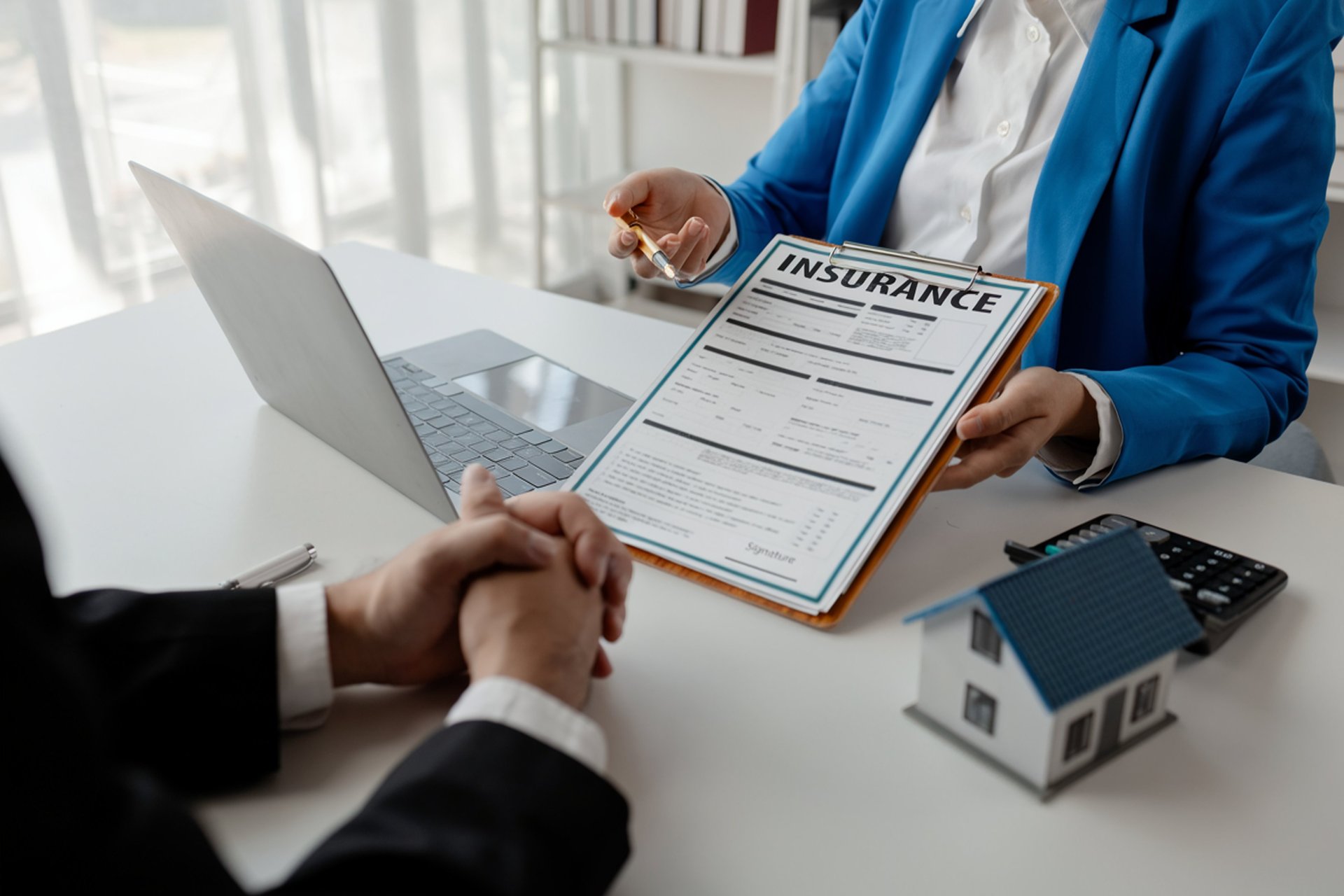 Here's a caption for the image: new house keys with money and a wallet.