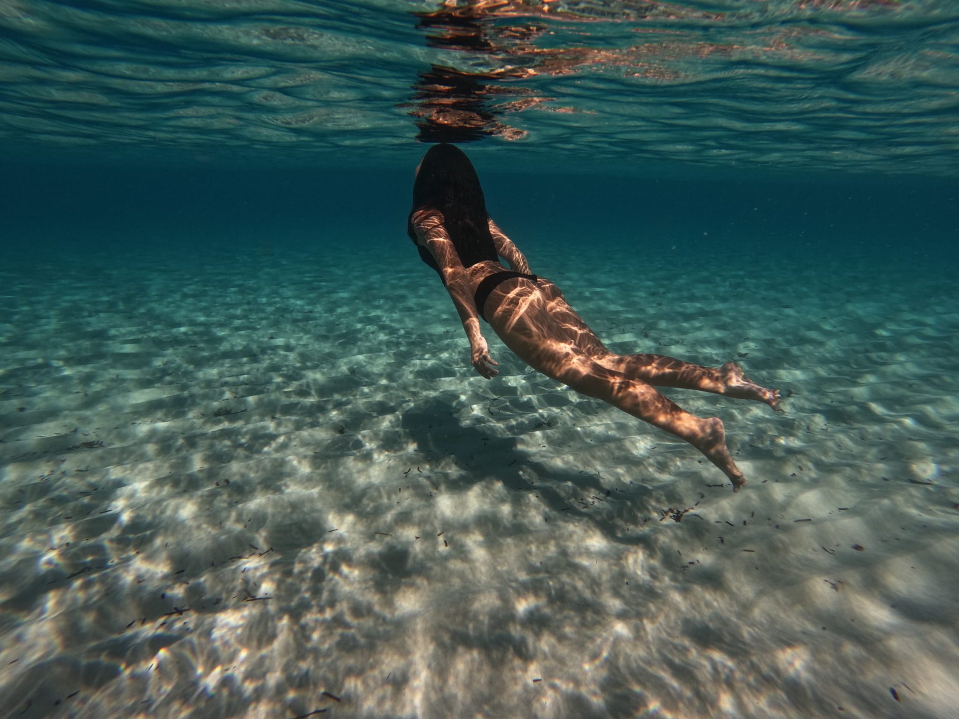 an abstract photo of a curved building with a blue sky in the background
