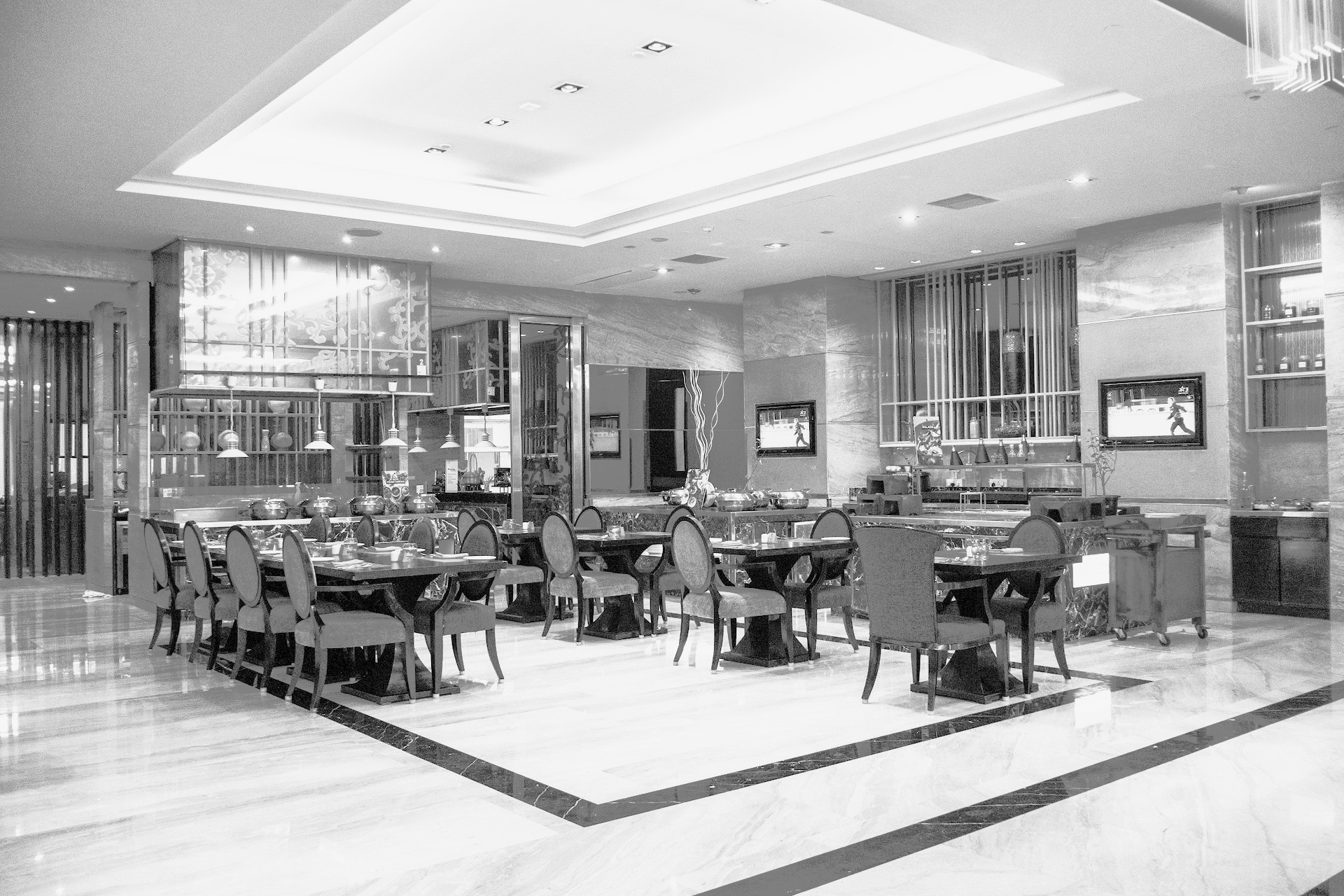 black and white image of a restaurant upholstery chairs