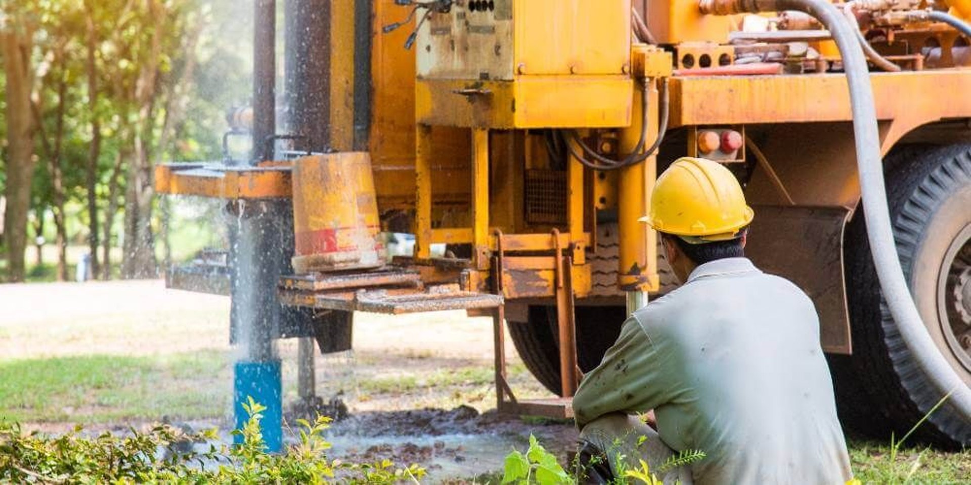 woman wearing yellow long-sleeved dress under white clouds and blue sky during daytime