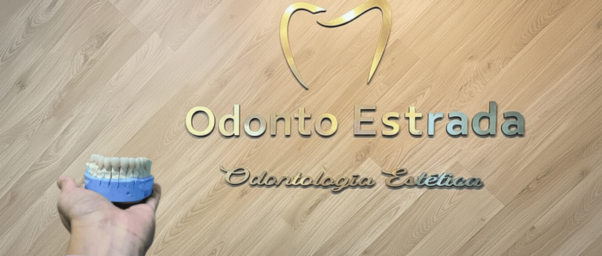 a close up of a person wearing blue gloves holding a toothbrush