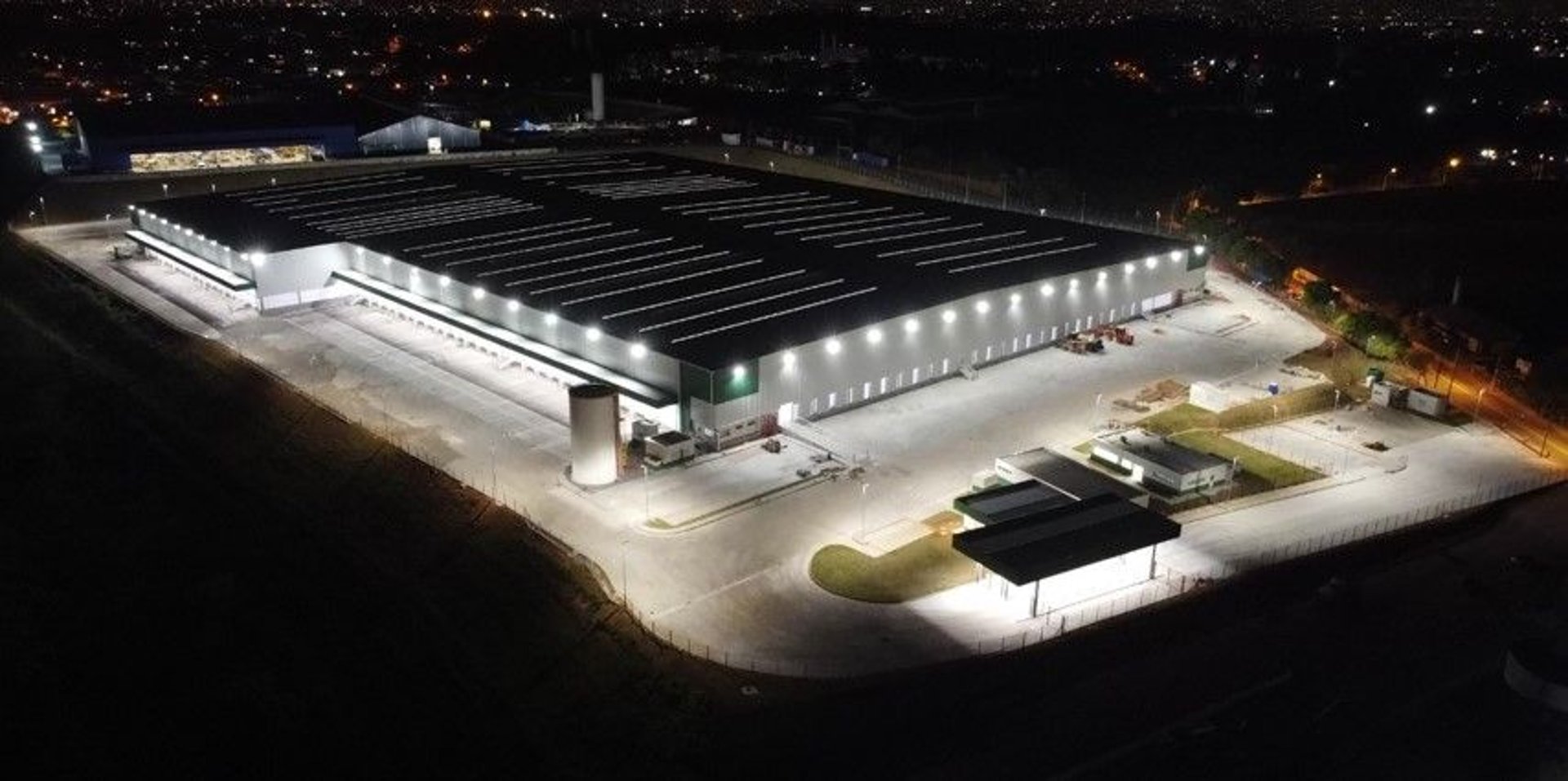 an abstract photo of a curved building with a blue sky in the background