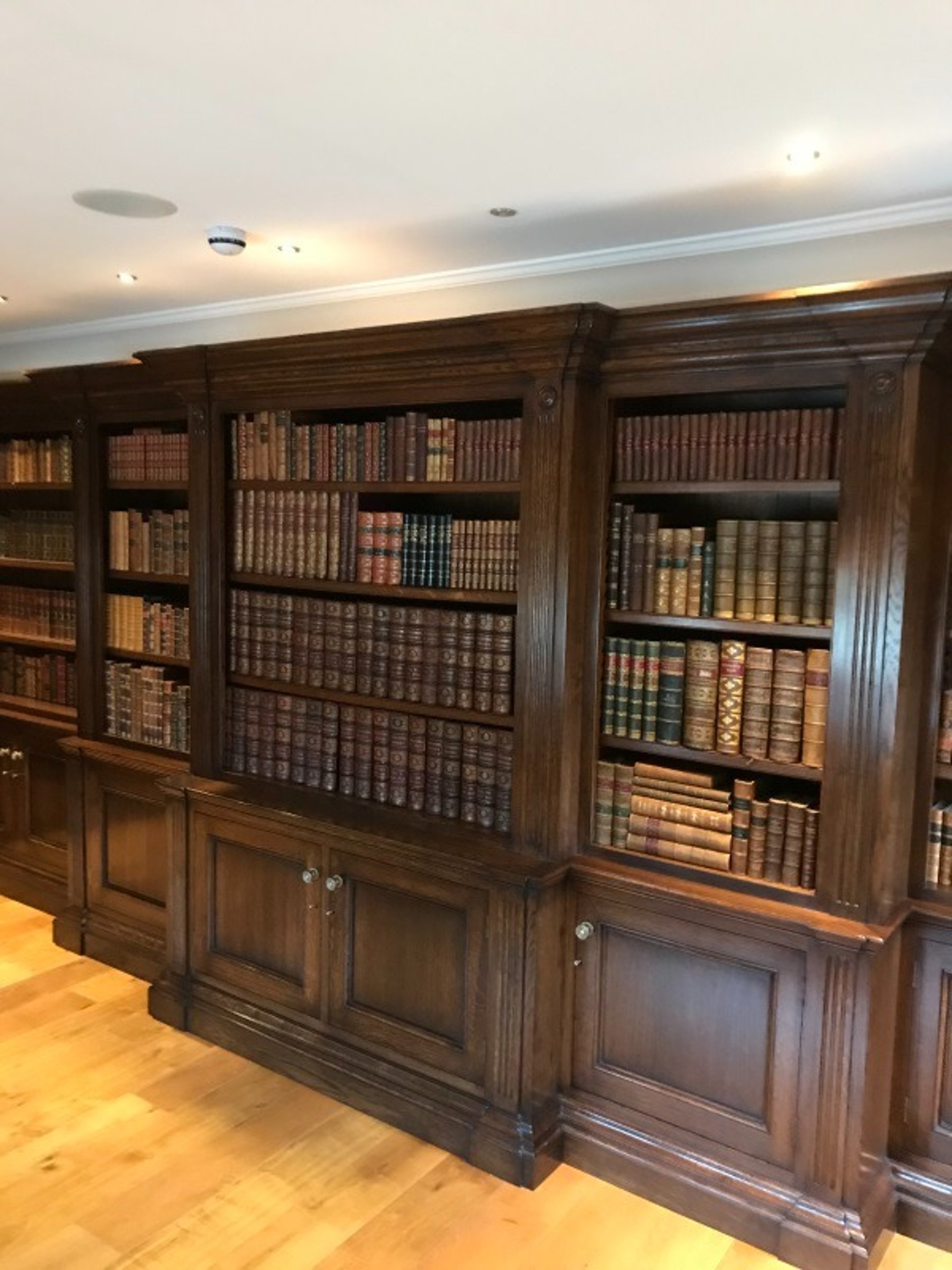 an abstract photo of a curved building with a blue sky in the background