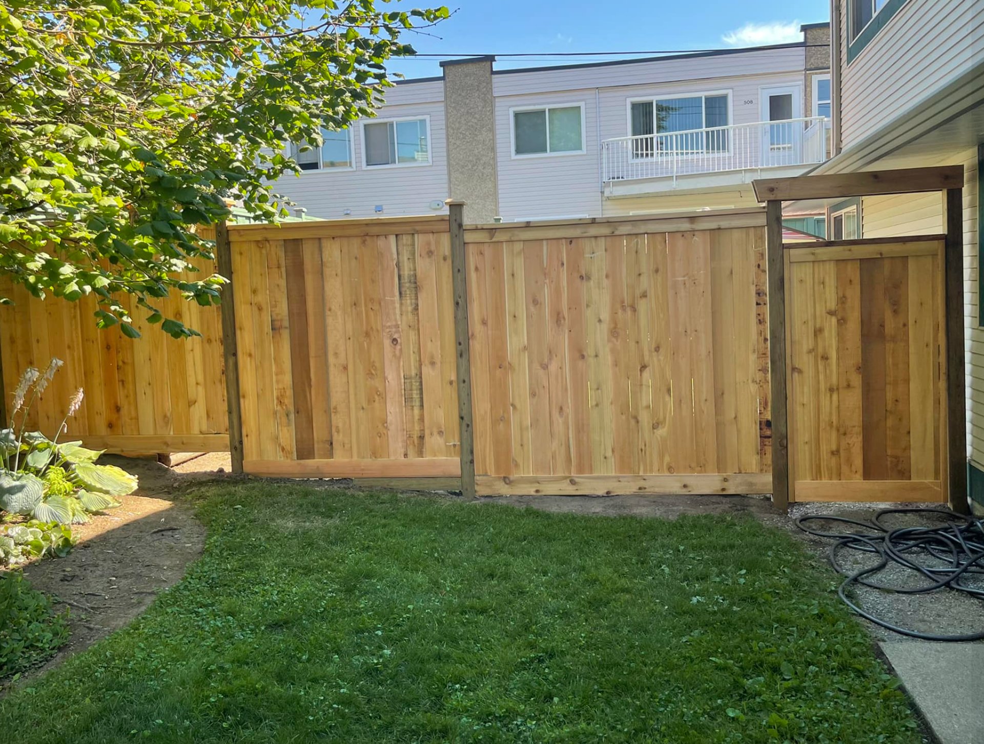 an abstract photo of a curved building with a blue sky in the background
