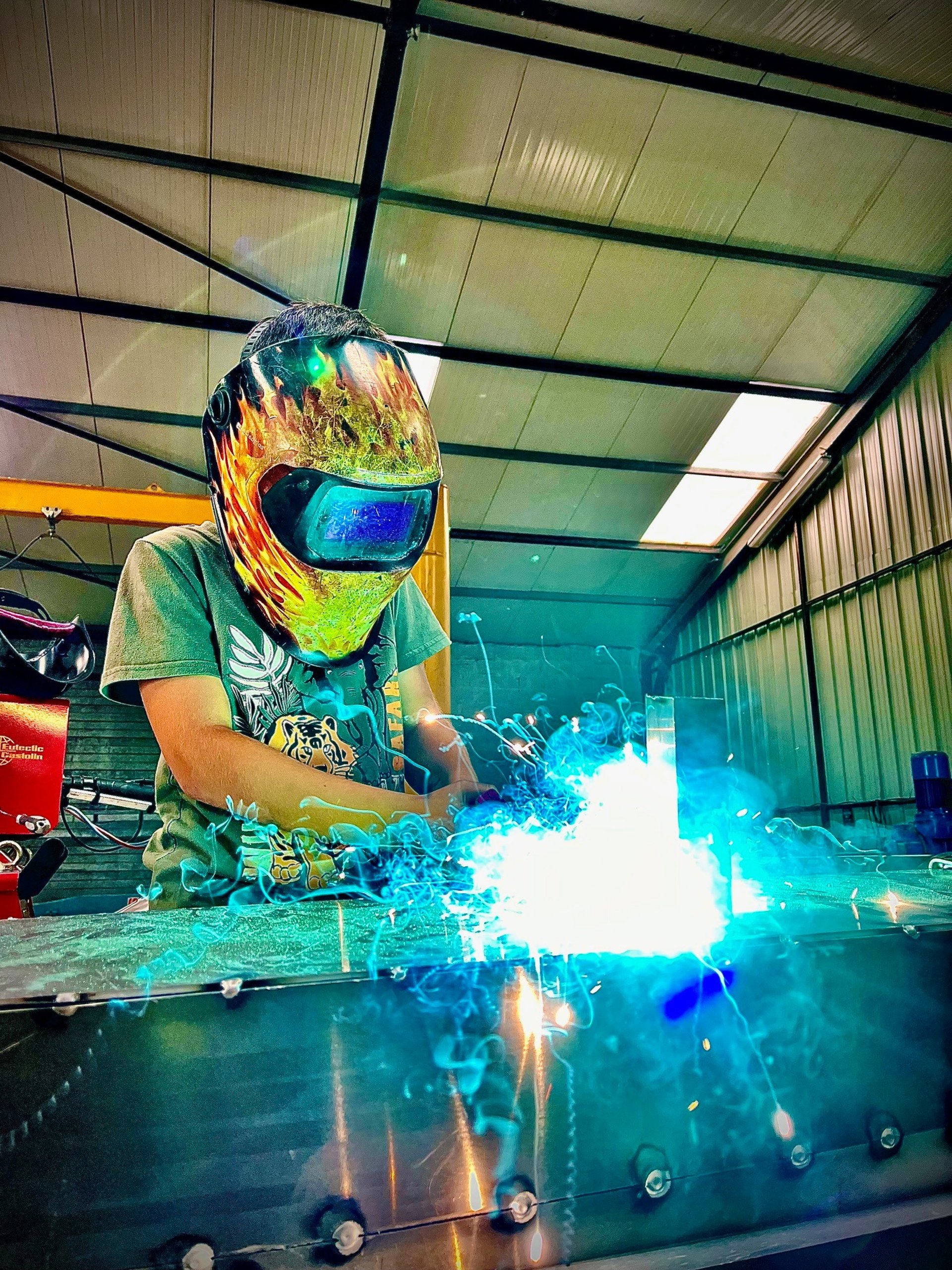 man using welding machine