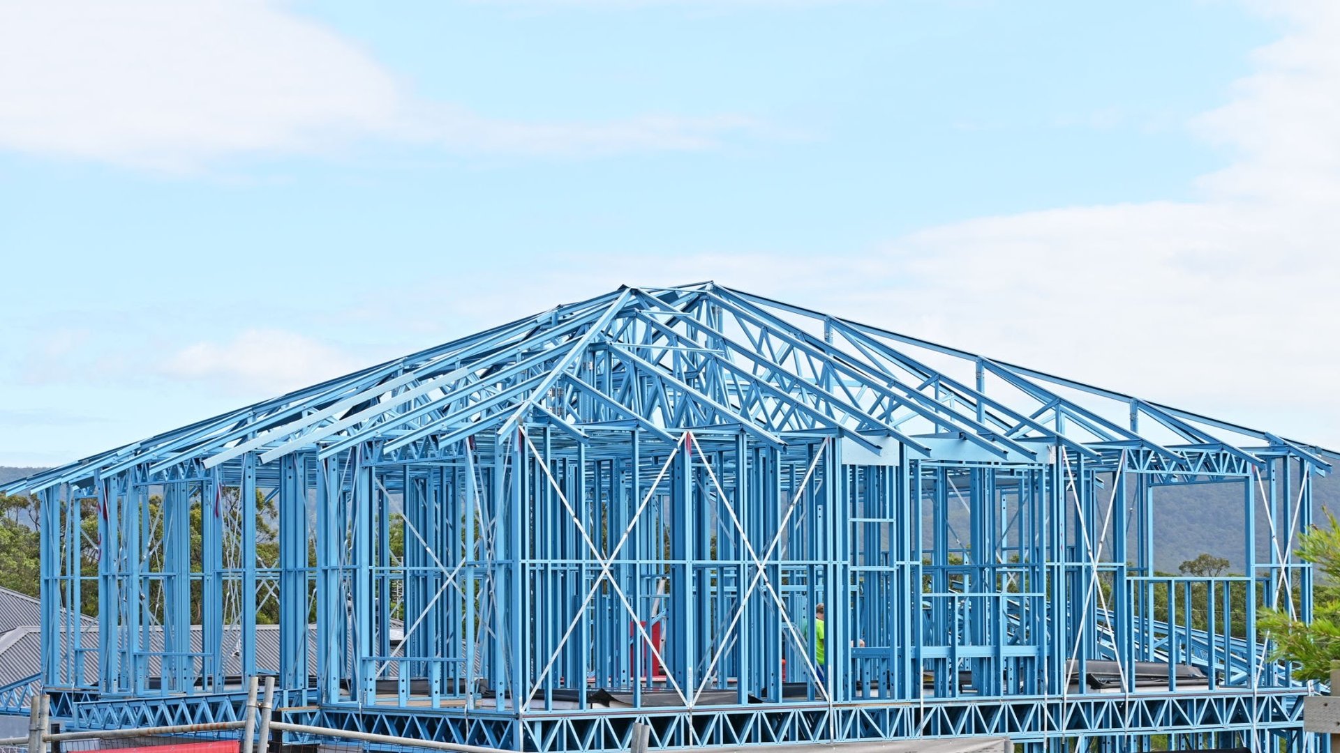 woman wearing yellow long-sleeved dress under white clouds and blue sky during daytime