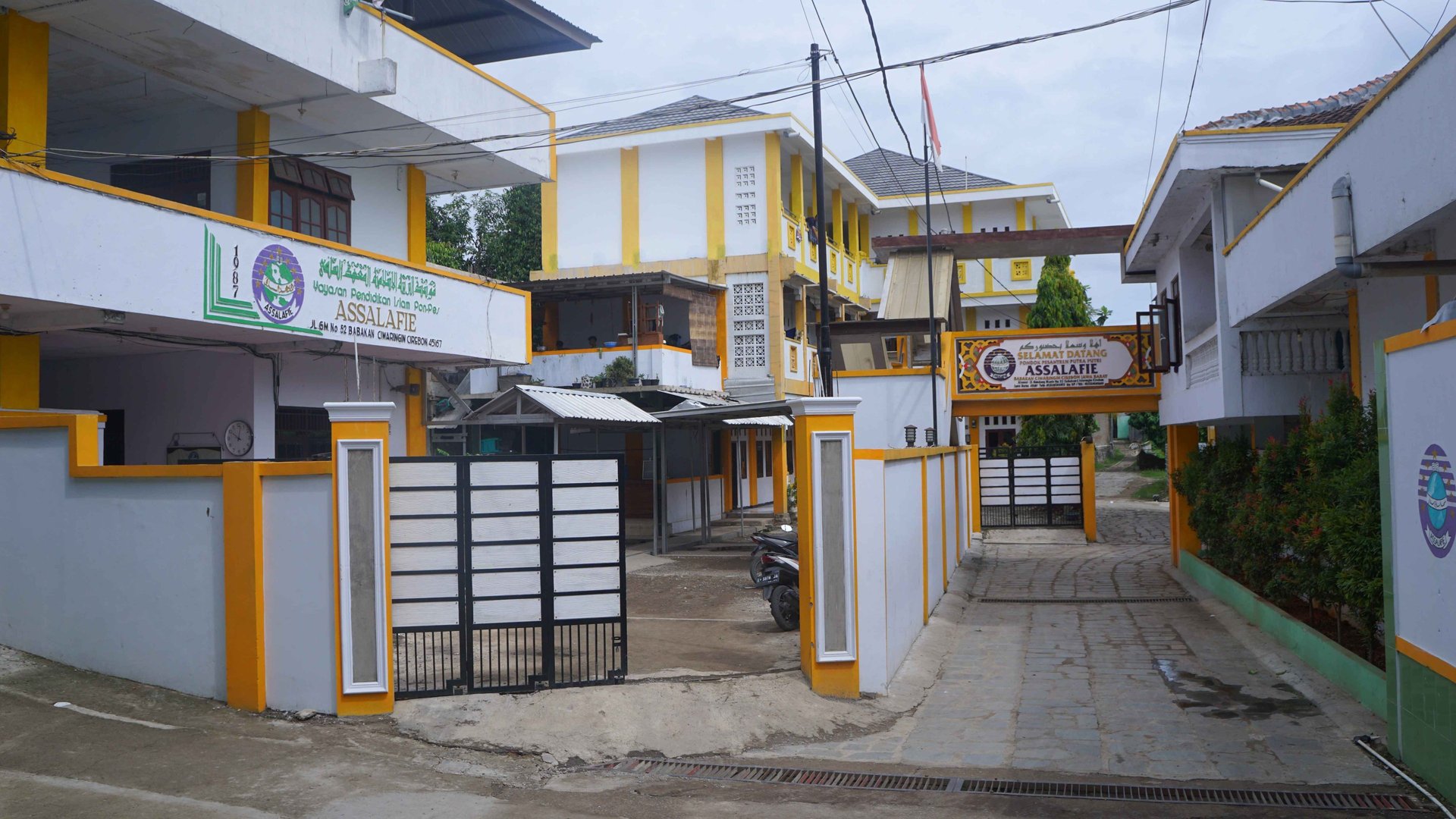 woman wearing yellow long-sleeved dress under white clouds and blue sky during daytime
