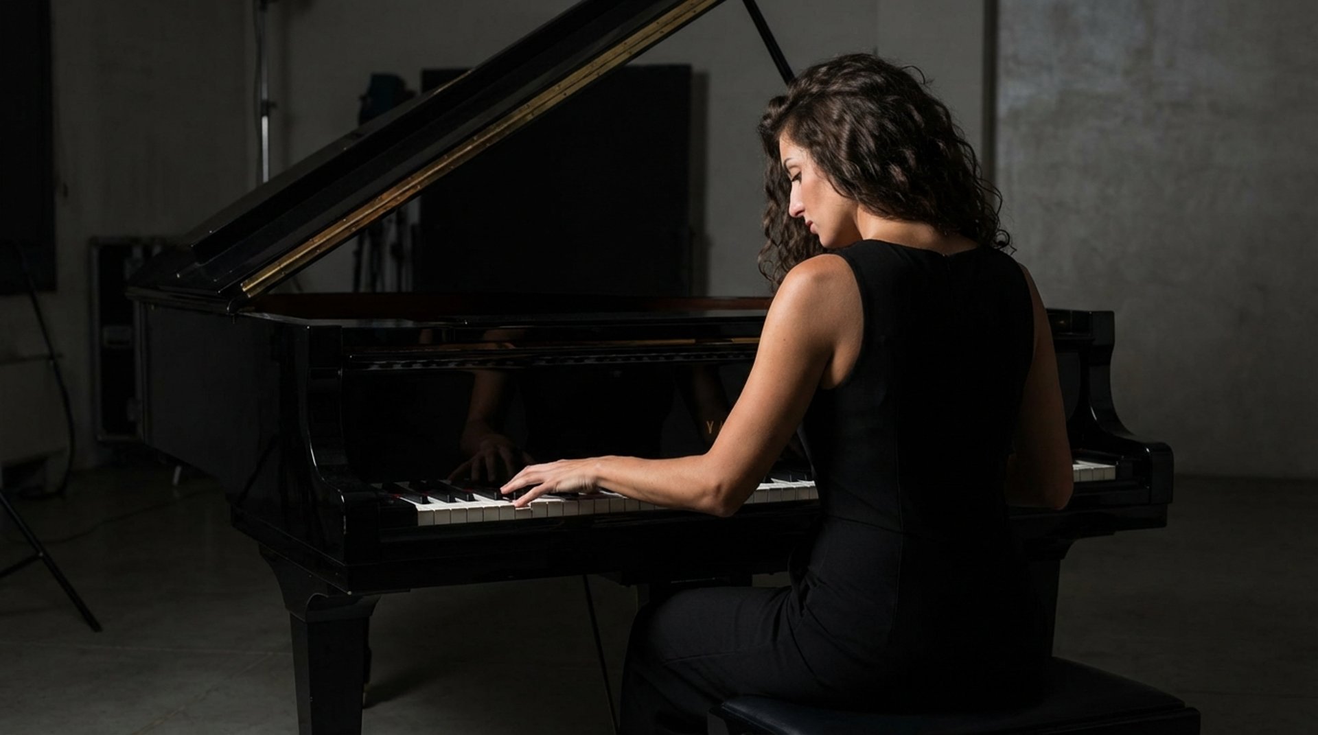 an abstract photo of a curved building with a blue sky in the background